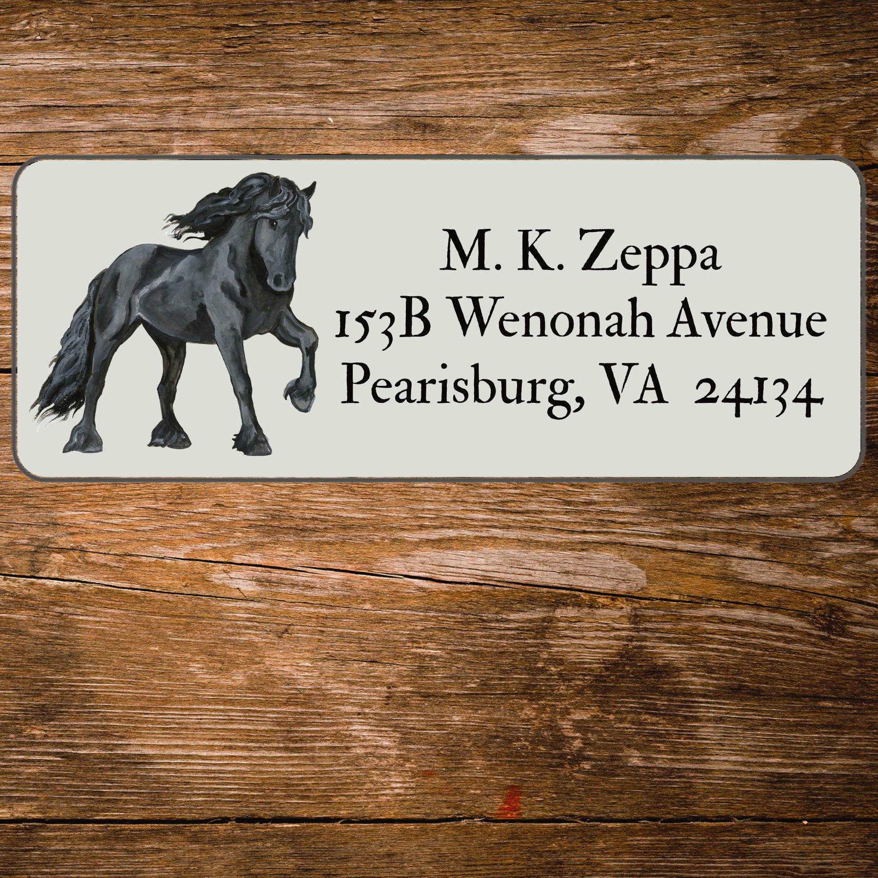 Return address label with an illustration of a Friesian Horse.