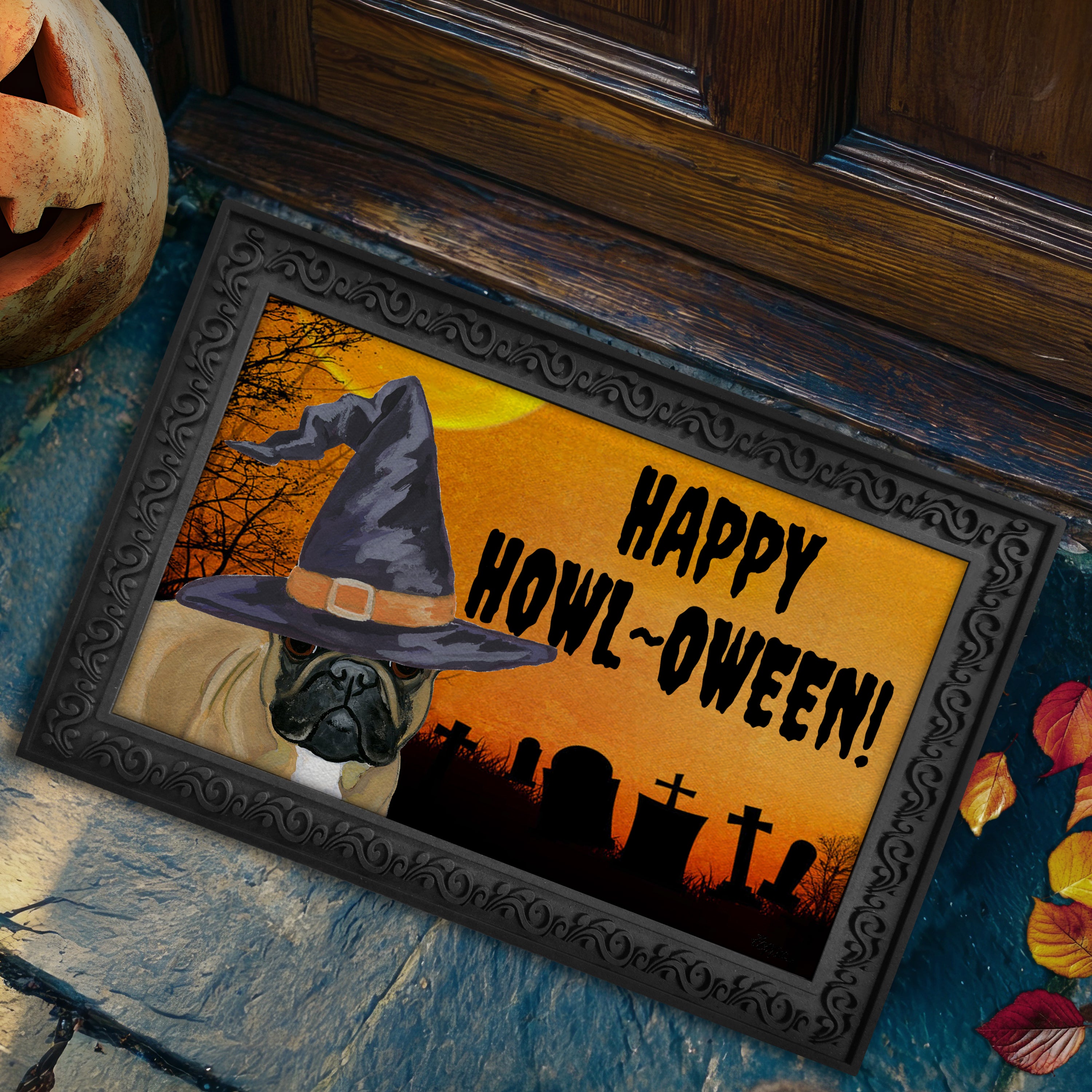 Halloween-themed doormat with a French Bulldog wearing a witch hat and 'Happy Howl-Oween!' text, placed on a stone surface.