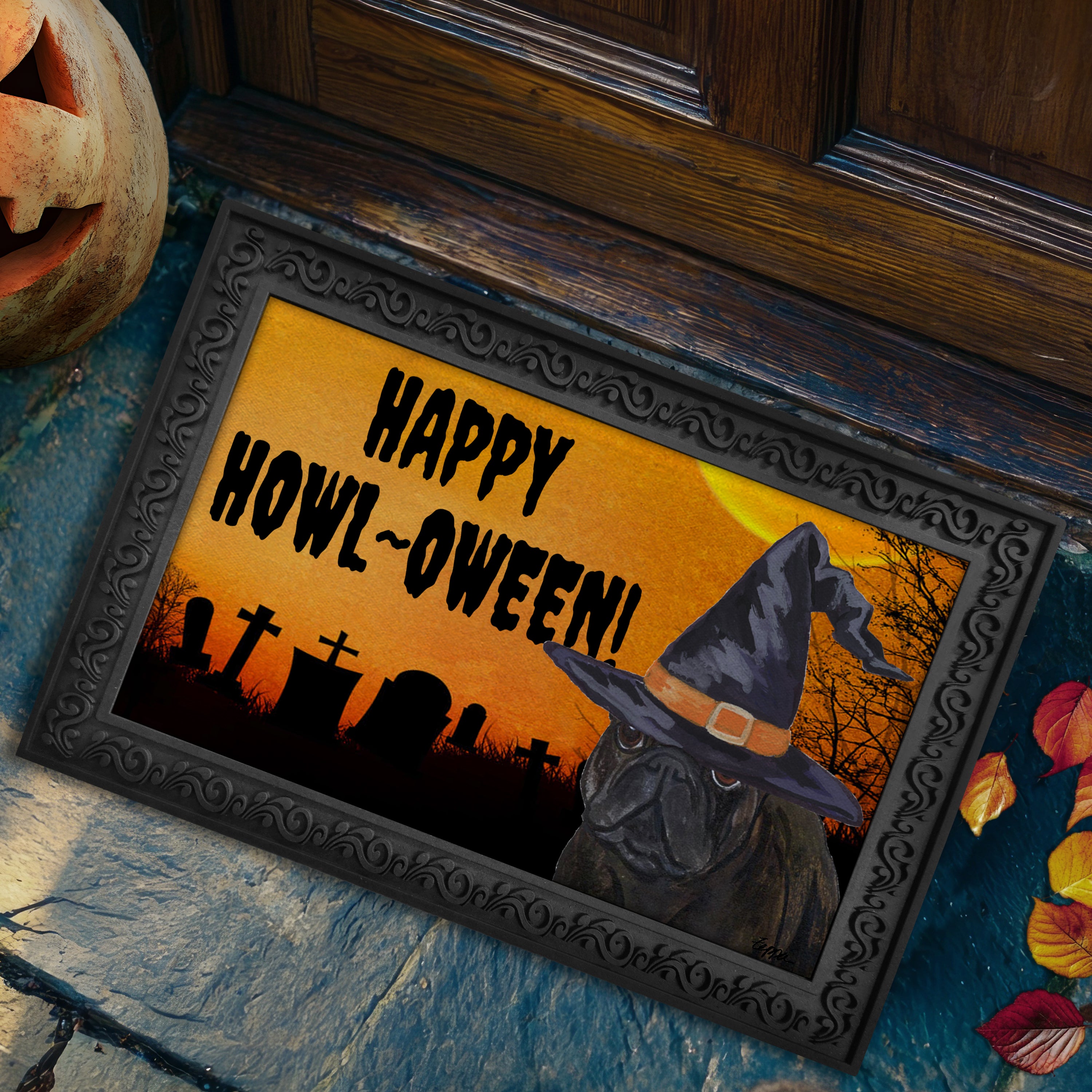 Halloween-themed doormat with a French Bulldog wearing a witch hat and 'Happy Howl-Oween!' text, placed on a stone surface.
