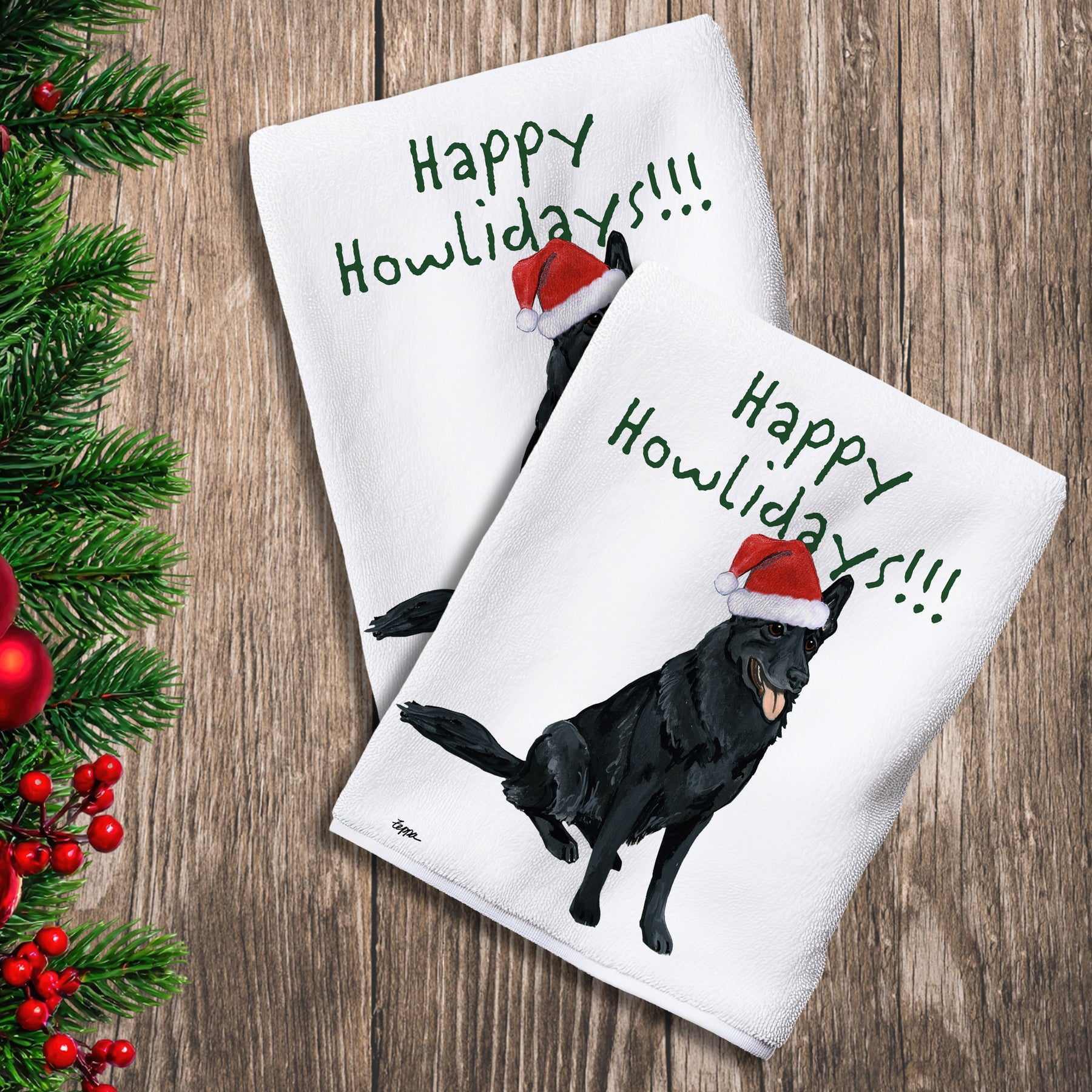 2 Kitchen Towels with a black  German Shepherd in a Santa Hat and Happy Howlidays text. 