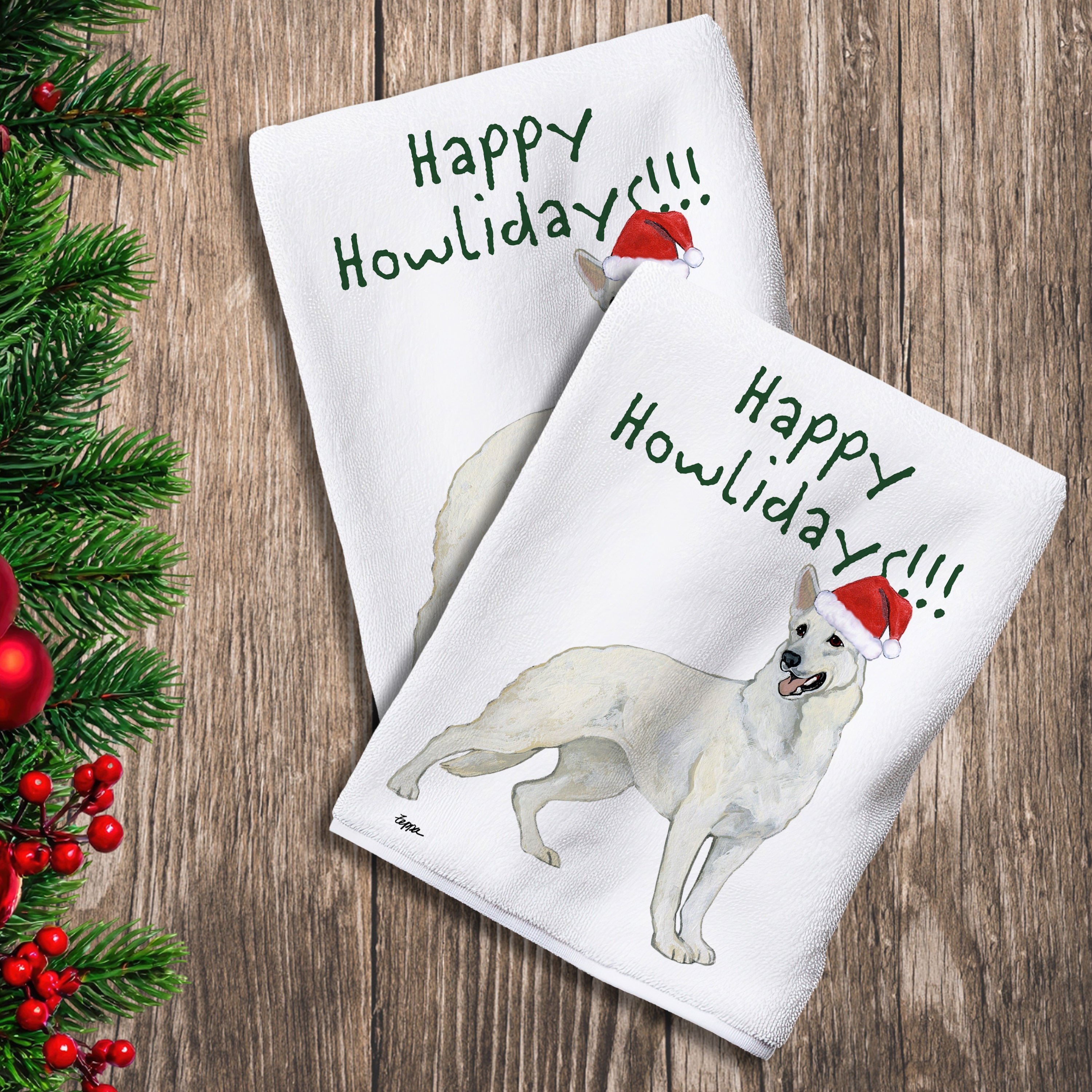 2 Kitchen Towels with a white German Shepherd in a Santa Hat and Happy Howlidays text. 