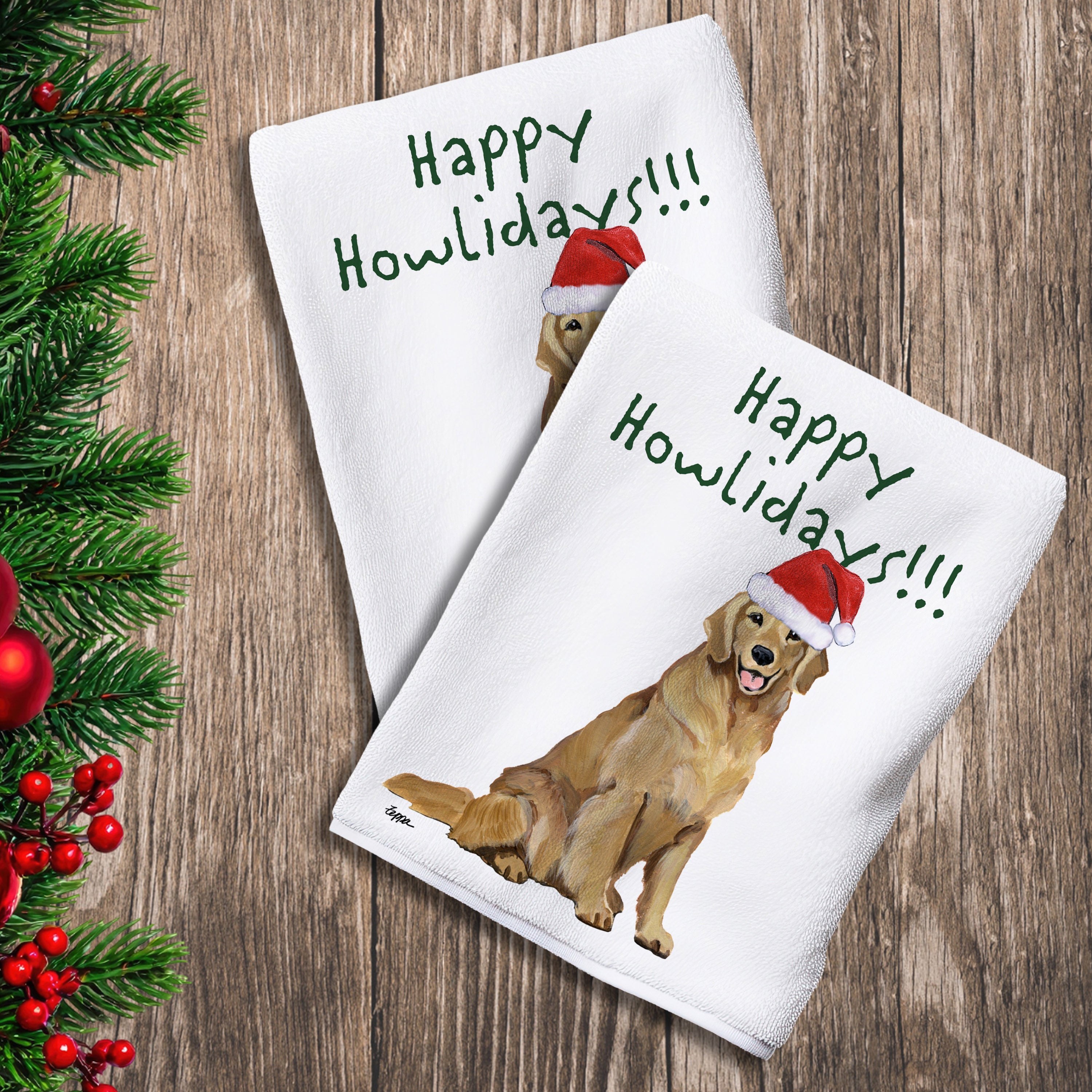 2 Kitchen Towels with a smiling Golden Retriever in a Santa Hat and Happy Howlidays text.