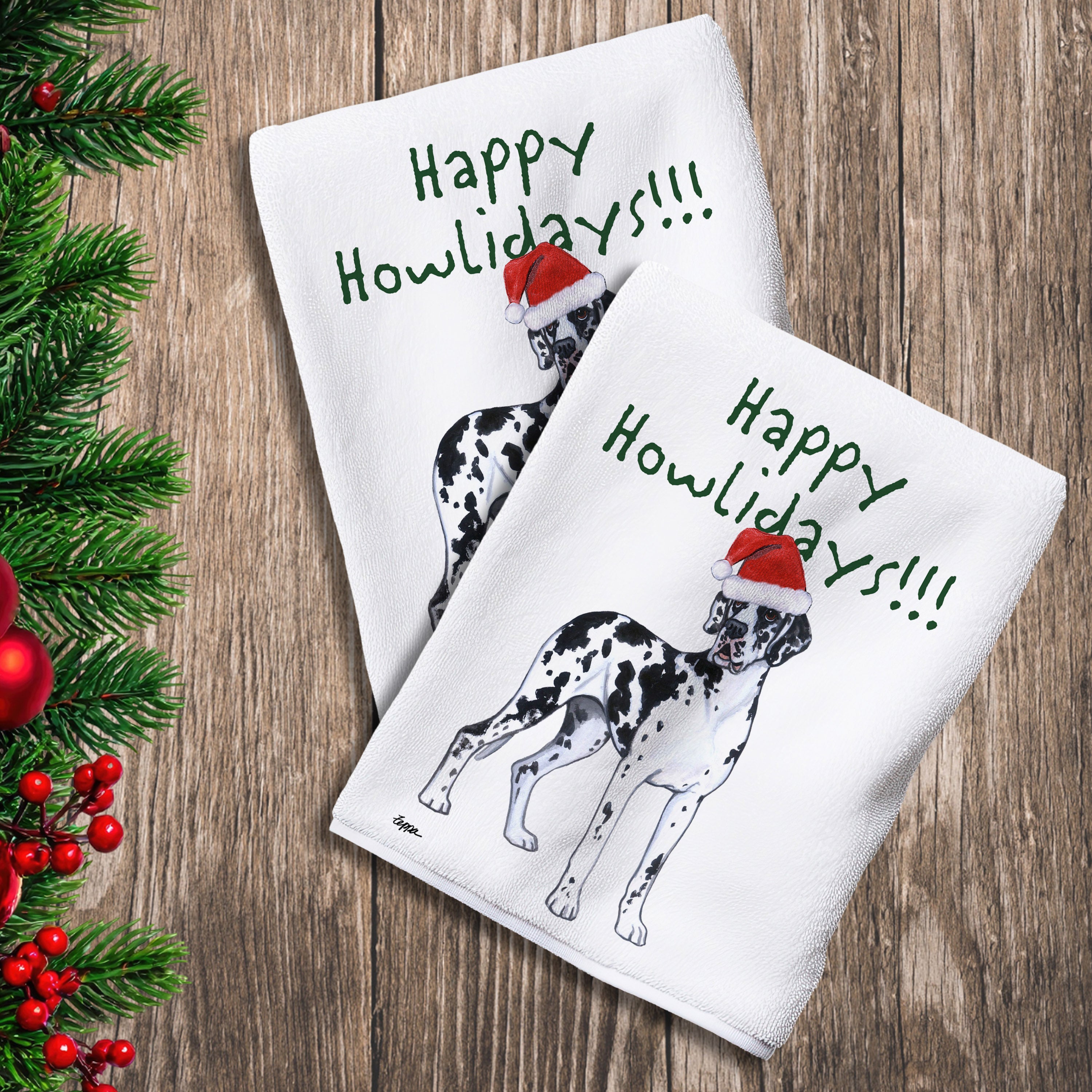 2 Kitchen Towels with a harlequin Great Dane with natural ears in a Santa Hat and Happy Howlidays text.