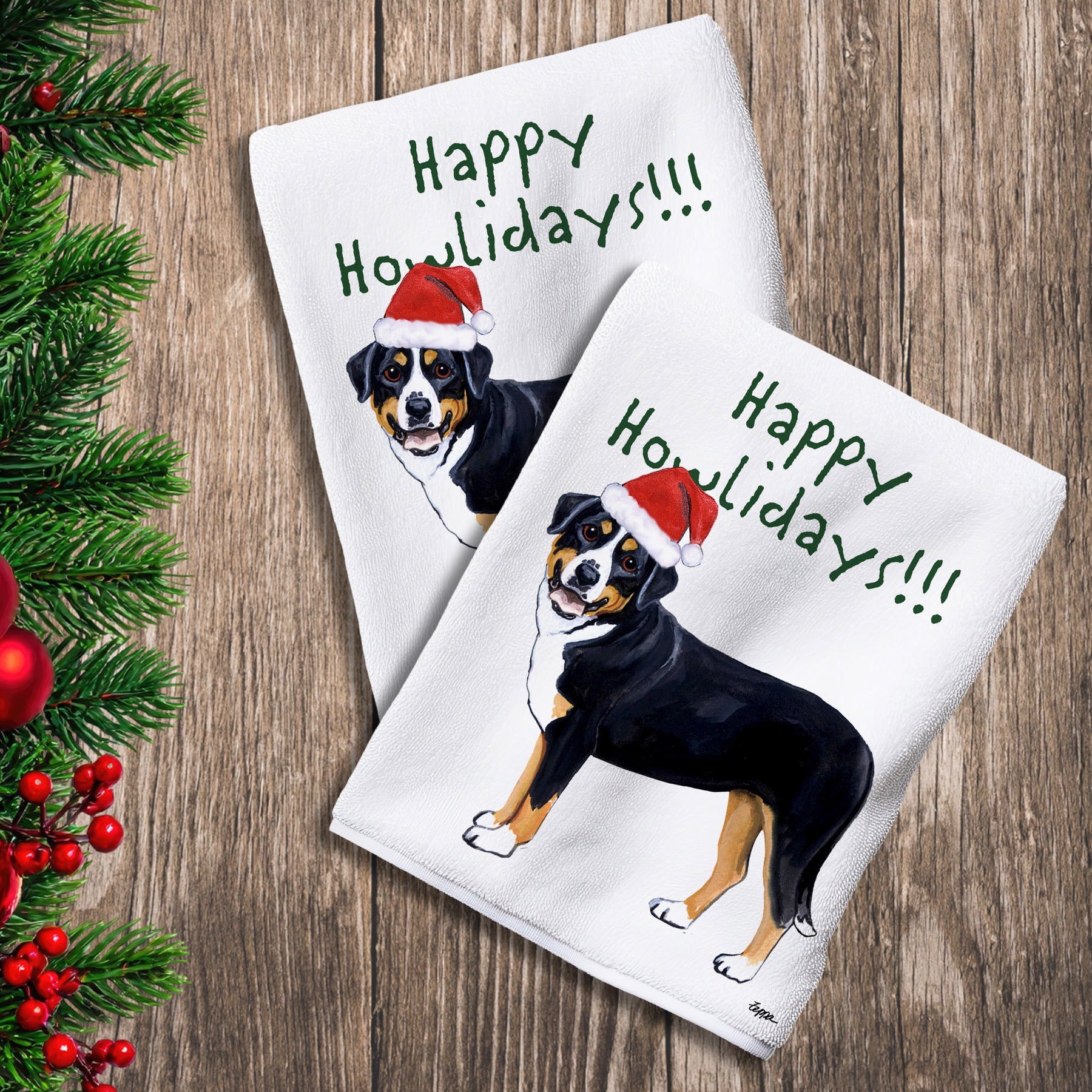 2 Kitchen Towels with a Greater Swiss Mountain Dog in a Santa Hat and Happy Howlidays text.