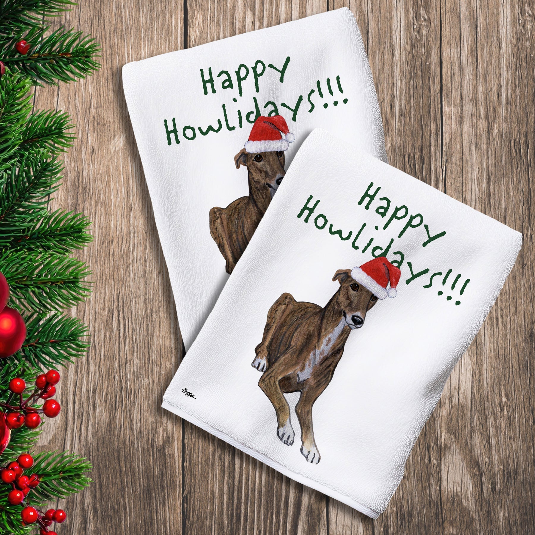 2 Kitchen Towels with a Greyhound in a Santa Hat and Happy Howlidays text.