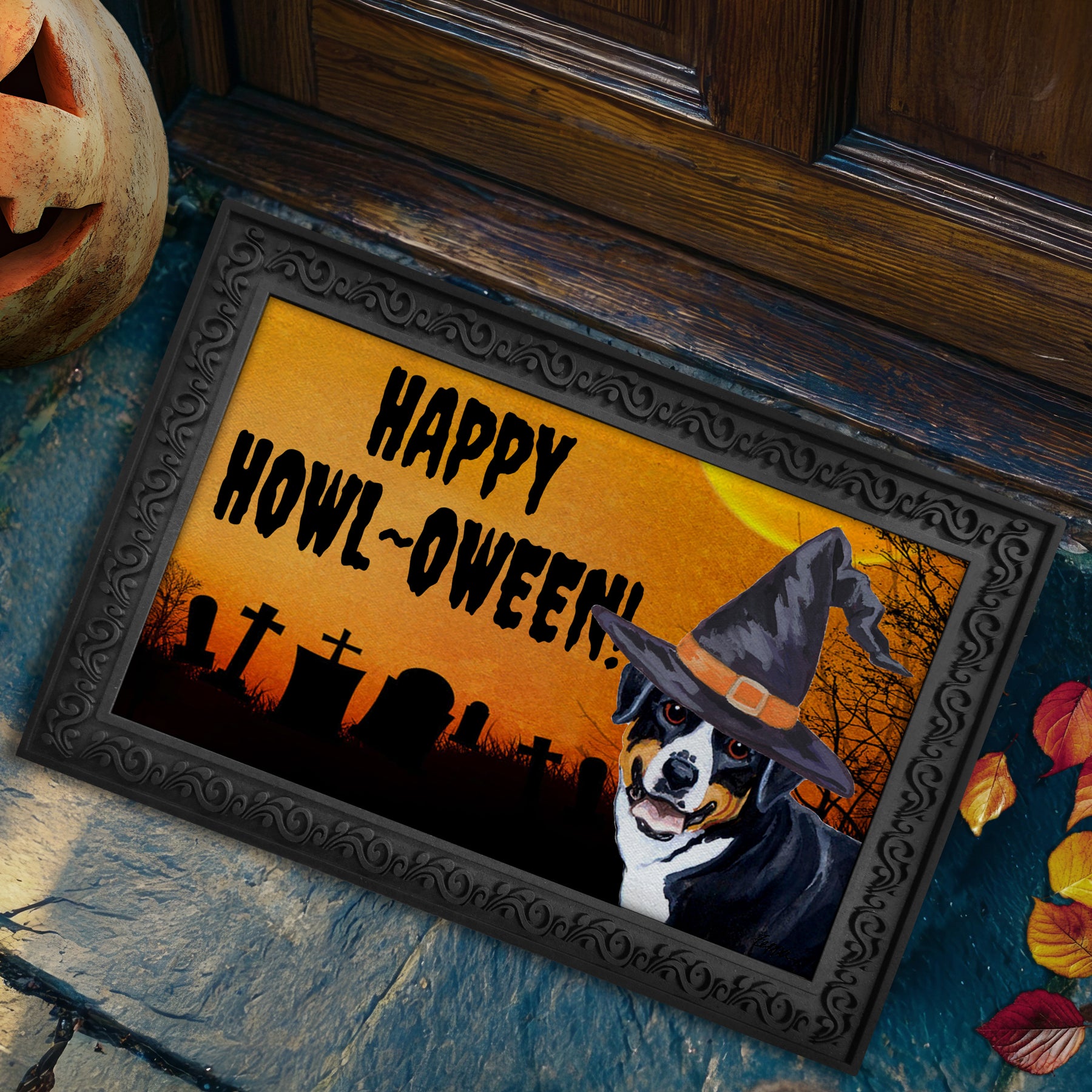 Halloween-themed doormat with a Greater Swiss Mountain Dog wearing a witch hat and 'Happy Howl-Oween!' text, placed on a stone surface.