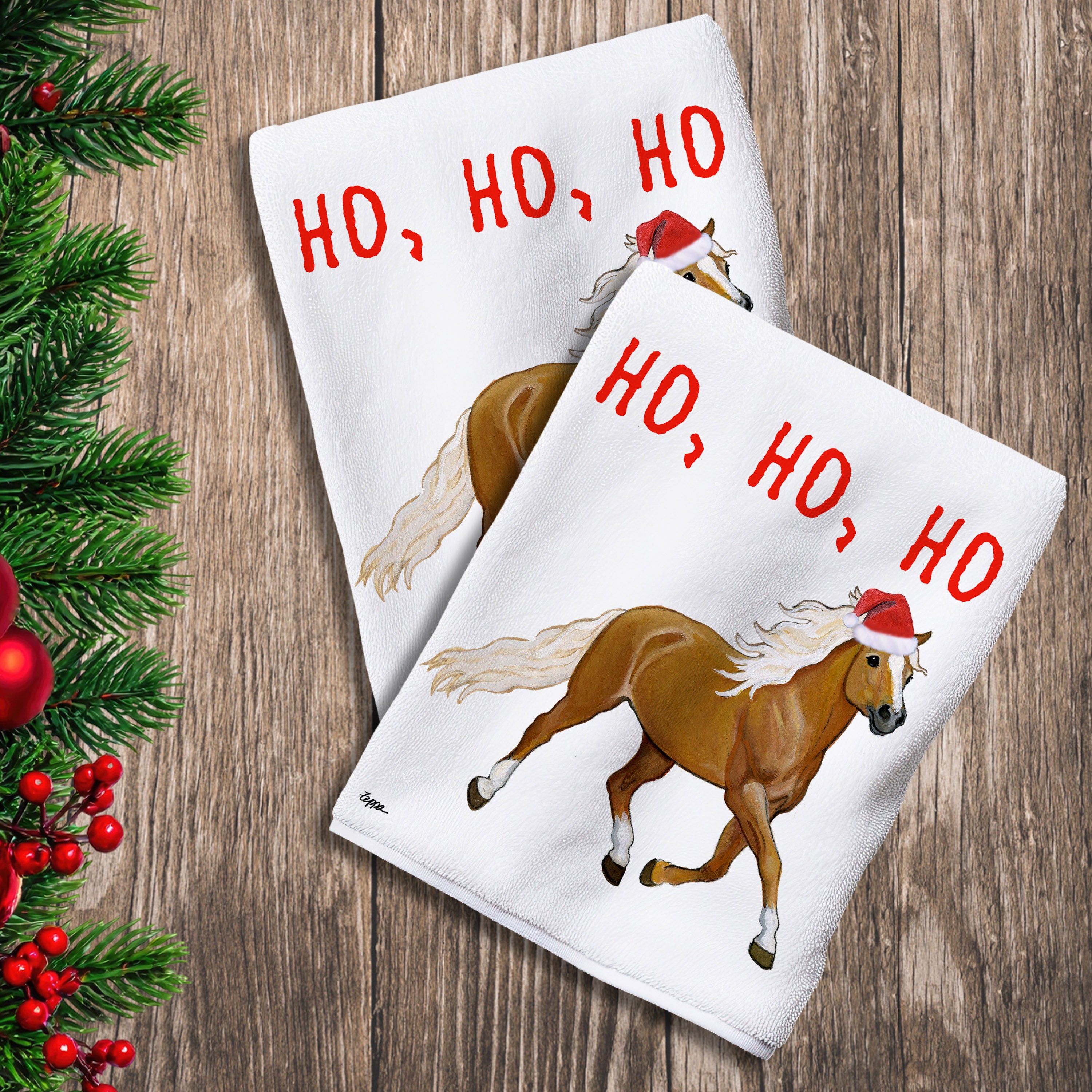 2 Kitchen Towels with a Haflinger horse in a Santa Hat and Ho Ho Ho text.


