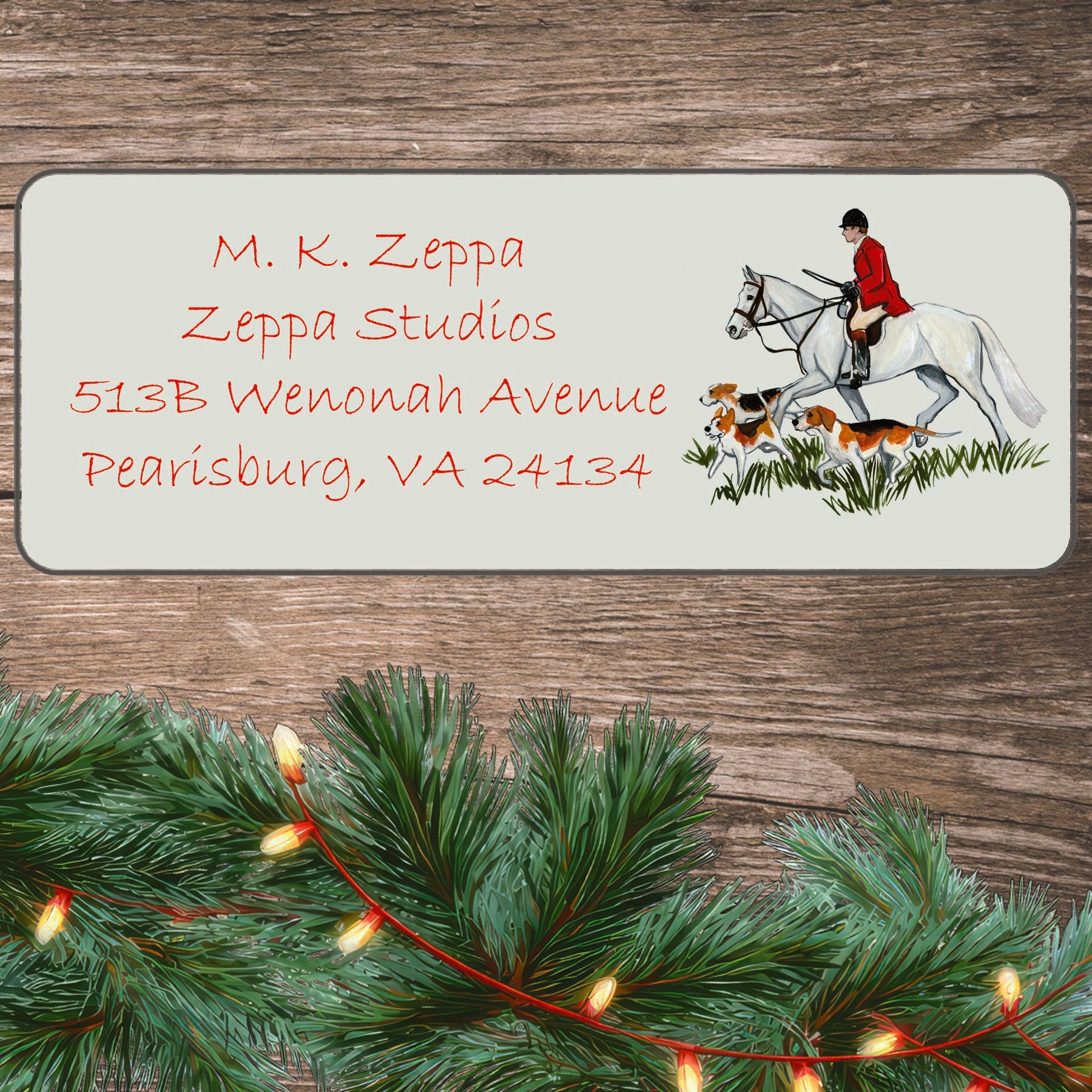 Holiday return address label with a Fox Hunt Scene illustration on a board with greenery.