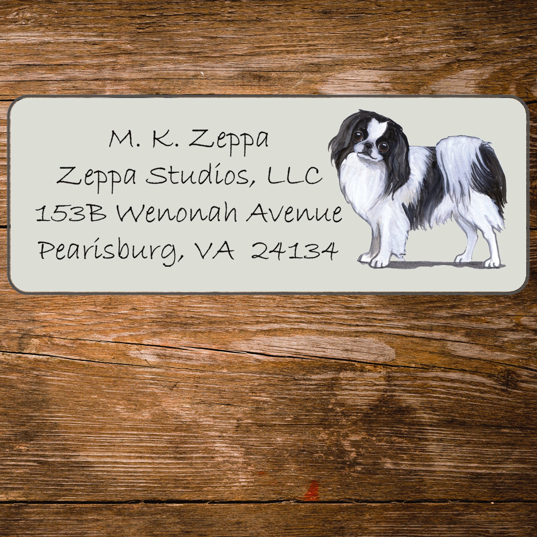 Return address label with a Japanese Chin illustration.