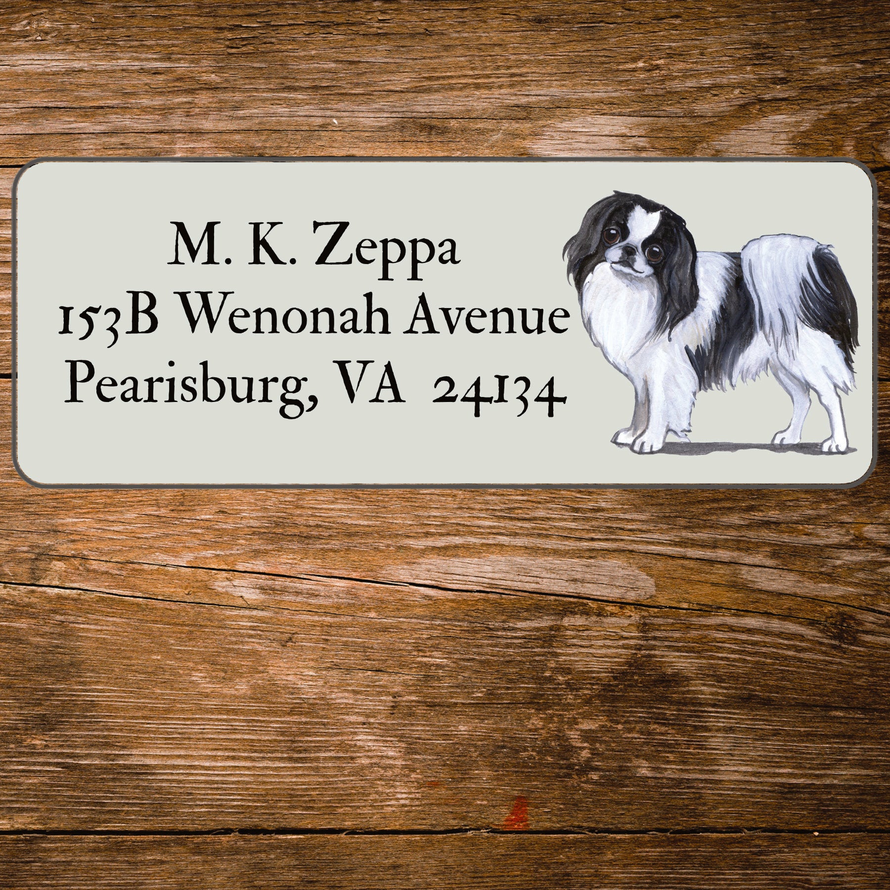 Return address label with a Japanese Chin illustration.
