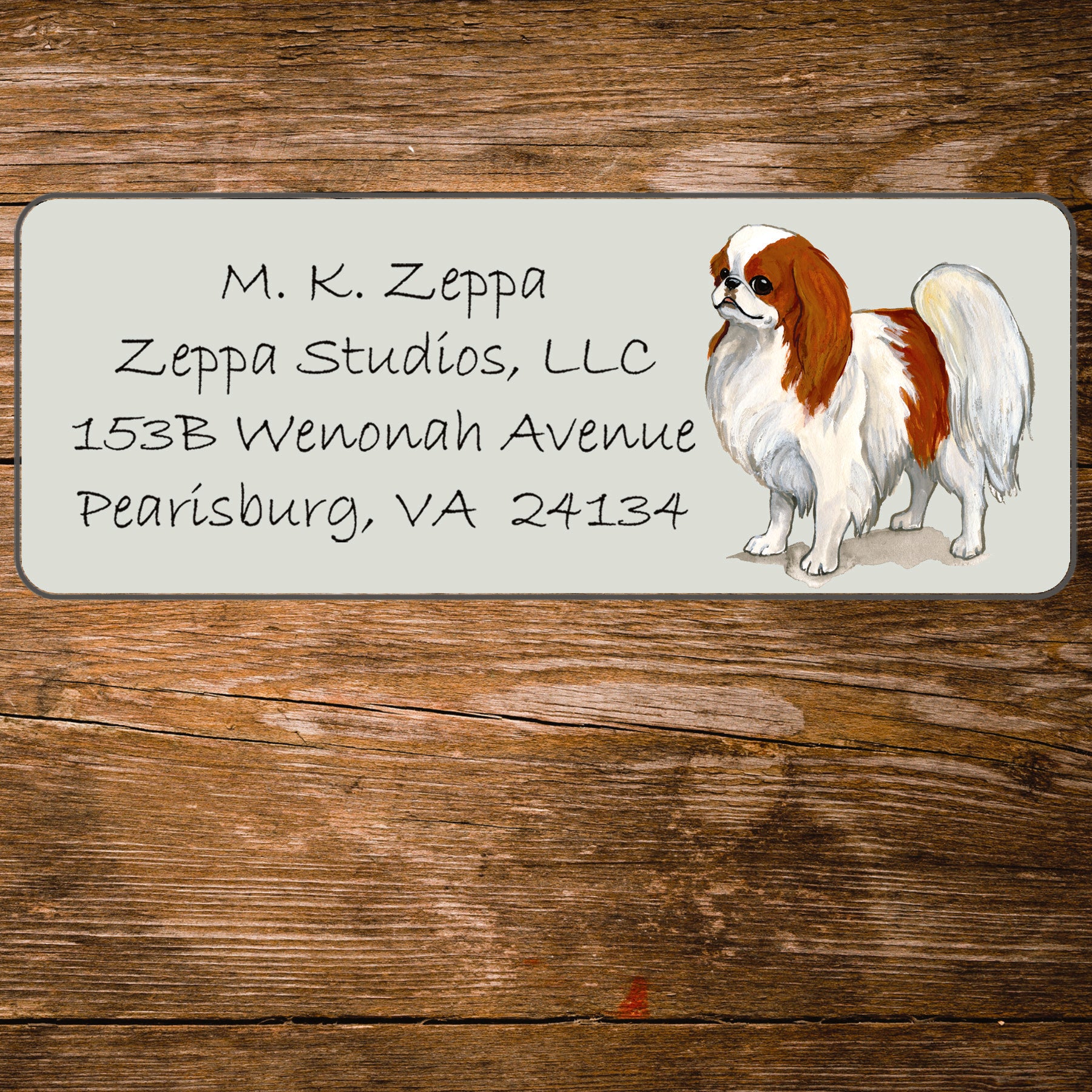 Return address label with a Japanese Chin illustration.