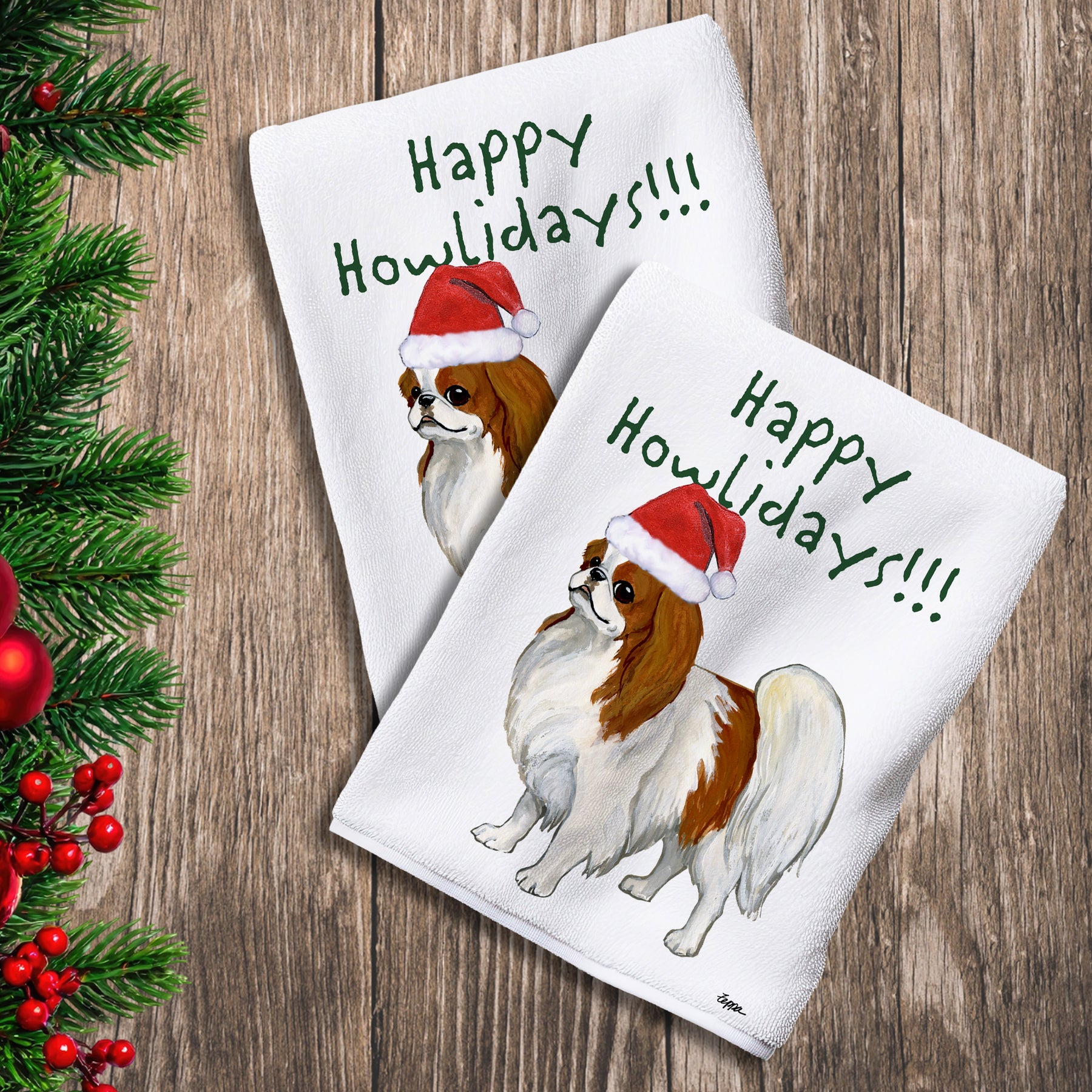2 Kitchen Towels with a red and white Japanese Chin in a Santa Hat and Happy Howlidays text.