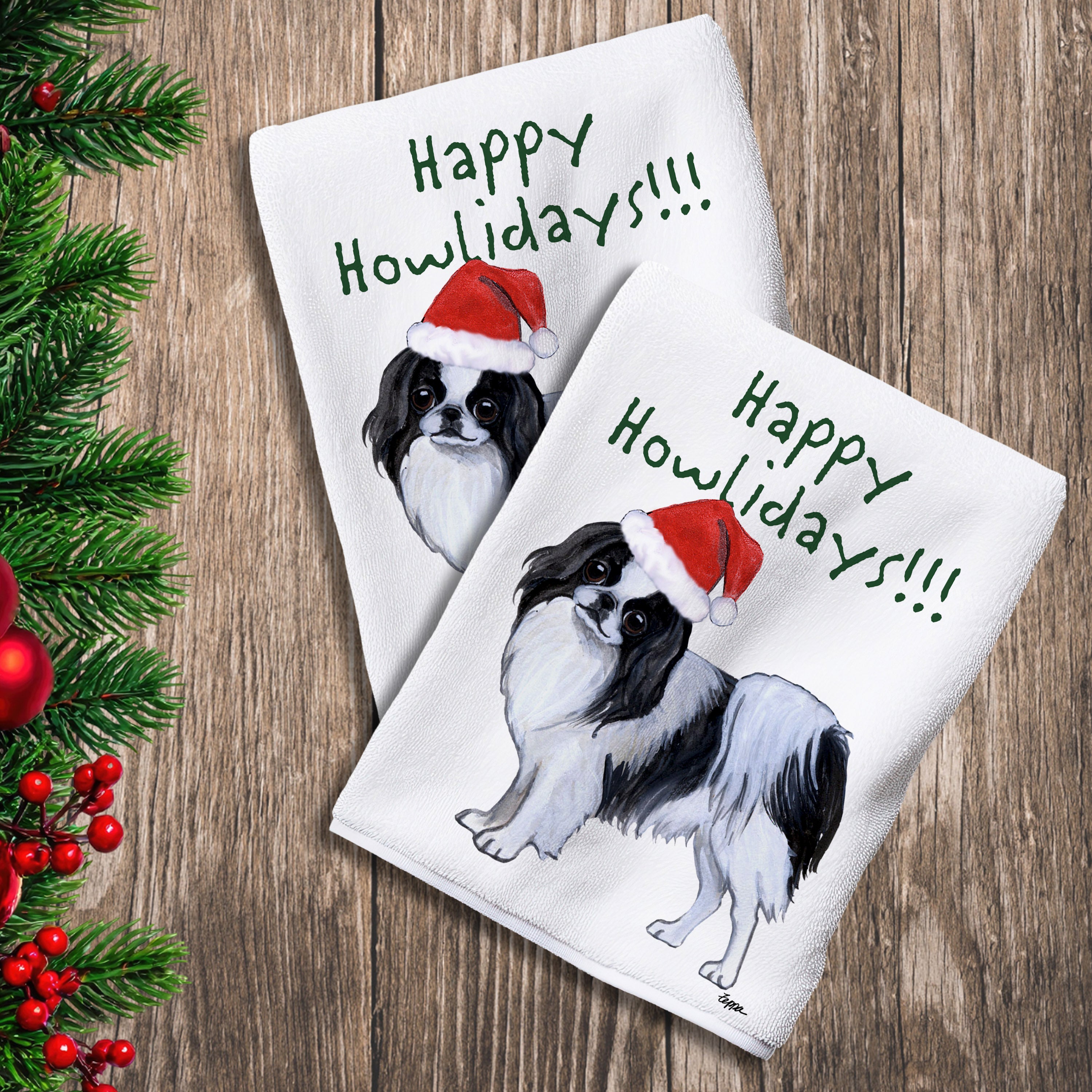2 Kitchen Towels with a Japanese Chin in a Santa Hat and Happy Howlidays text.