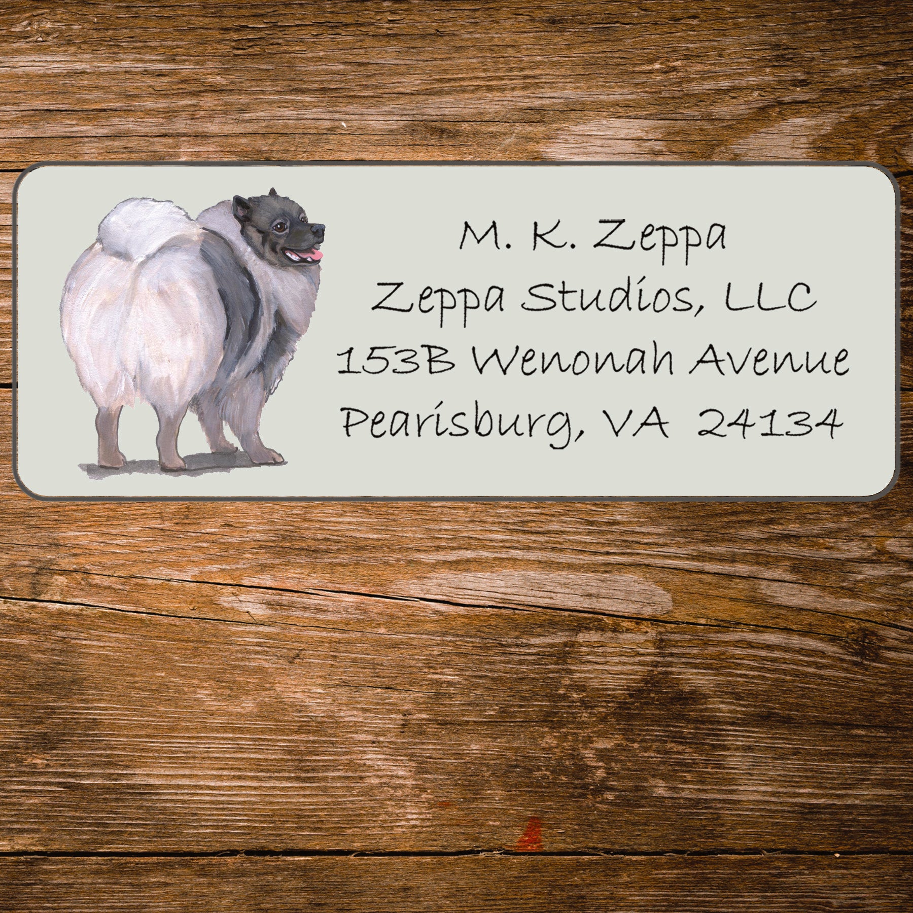 Return address label with a Keeshound illustration.