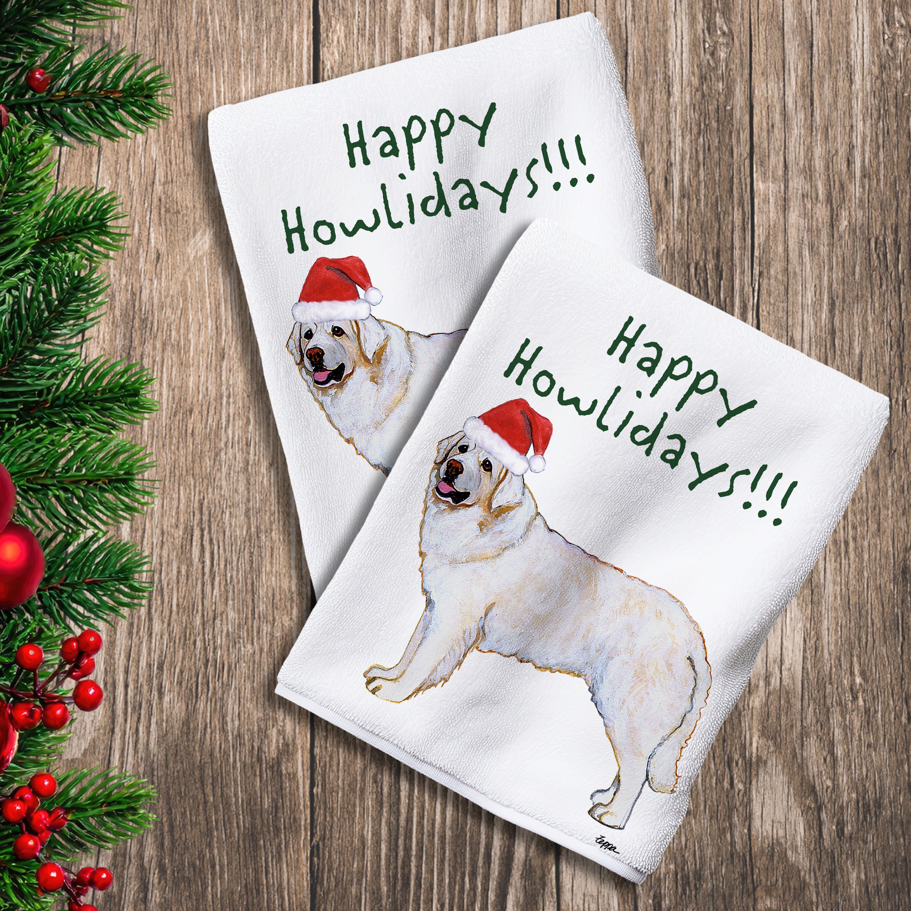 2 Kitchen Towels with a Kuvasc in a Santa Hat and Happy Howlidays text.