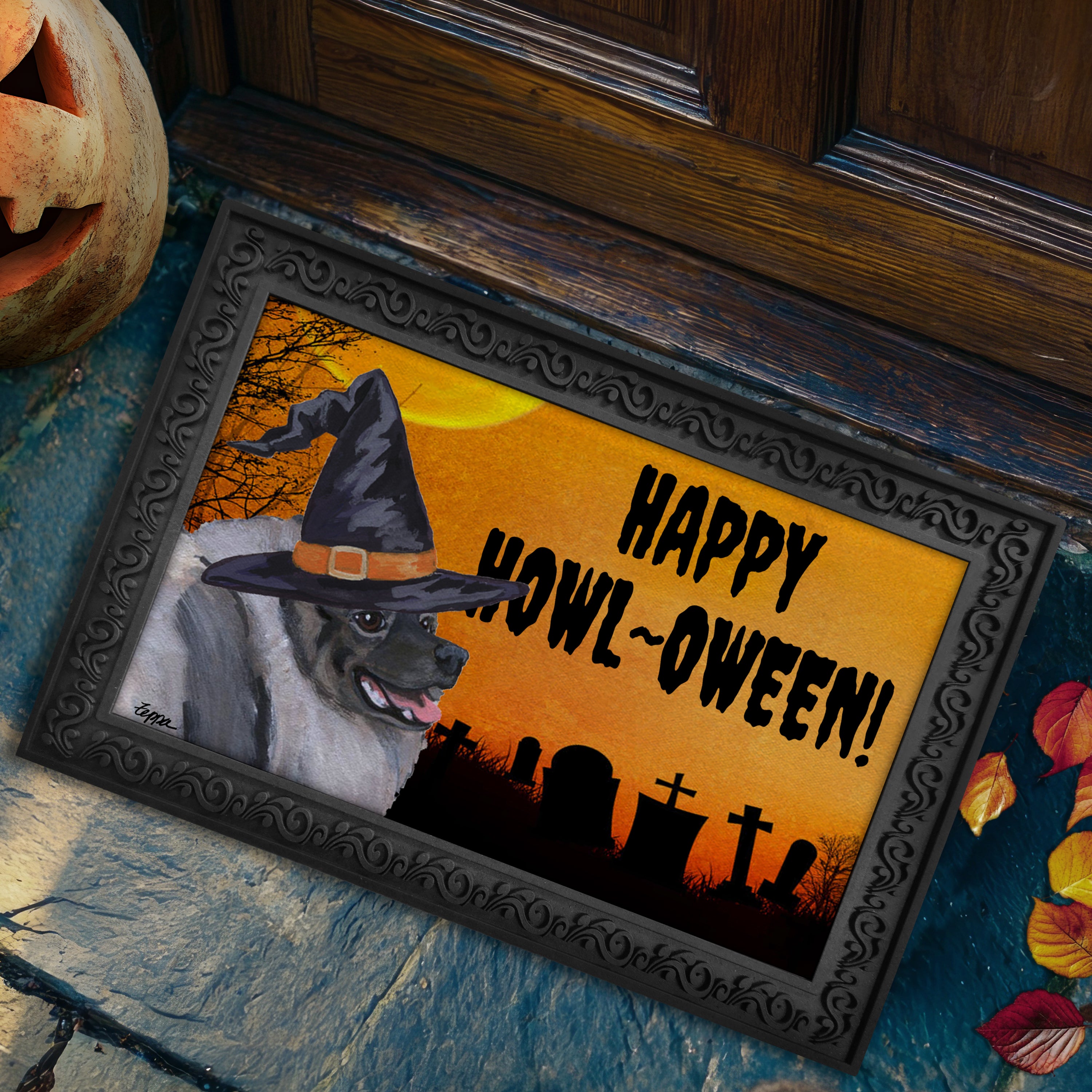 Halloween-themed doormat with a Keeshond wearing a witch hat and 'Happy Howl-Oween!' text, placed on a stone surface.