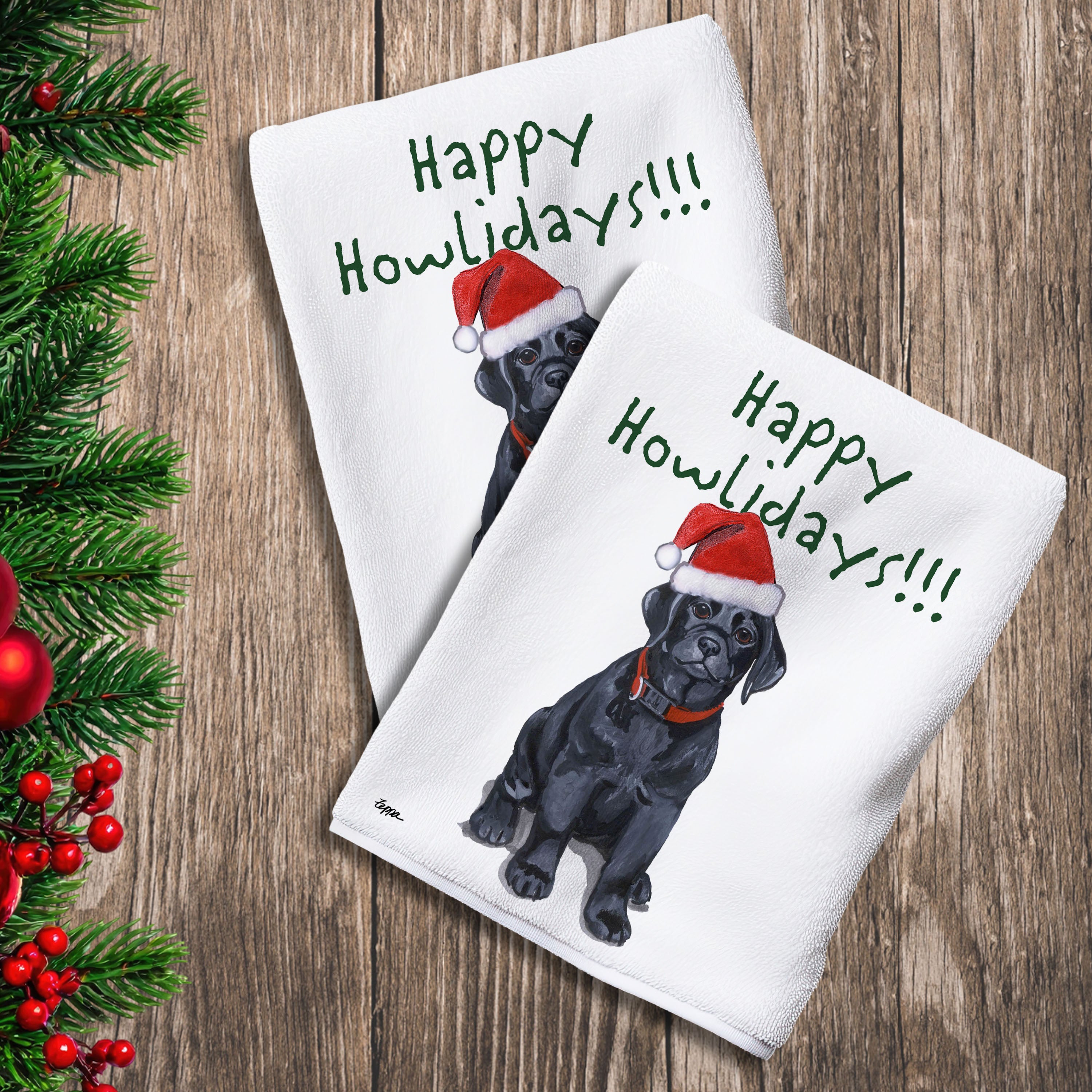 2 Kitchen Towels with a black Lab puppy in a Santa Hat and Happy Howlidays text.
