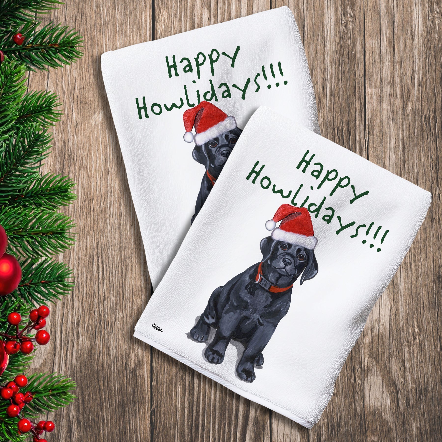 2 Kitchen Towels with a black Lab puppy in a Santa Hat and Happy Howlidays text.