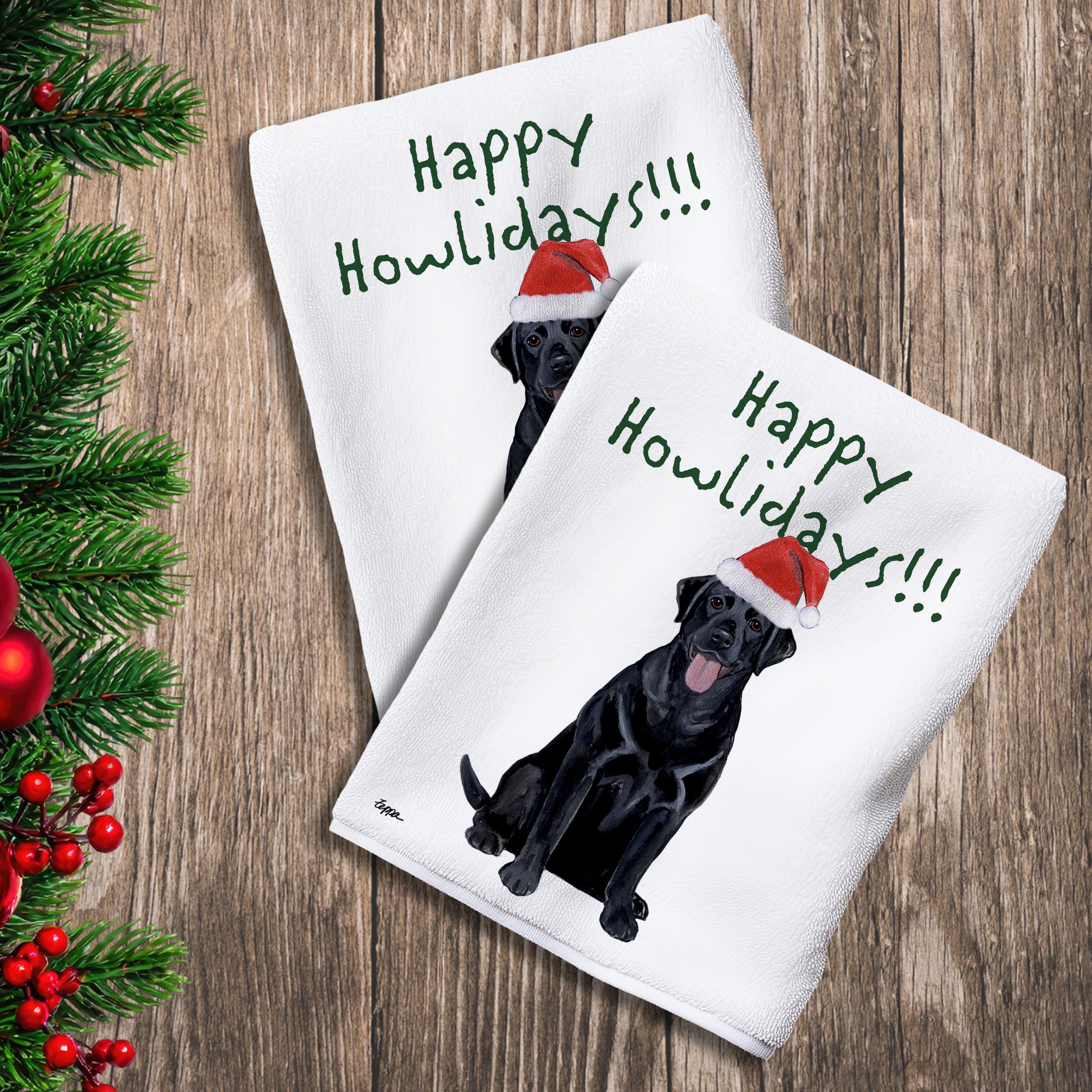 2 Kitchen Towels with a black Lab in a Santa Hat and Happy Howlidays text.