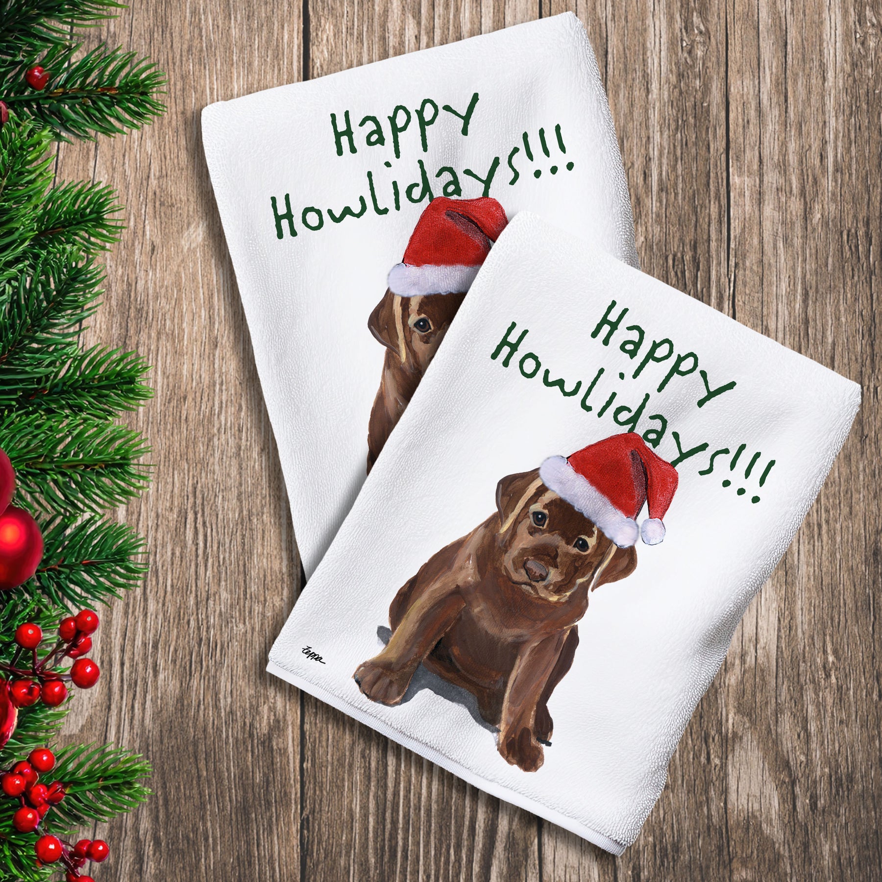 2 Kitchen Towels with a chocolate Lab puppy in a Santa Hat and Happy Howlidays text.