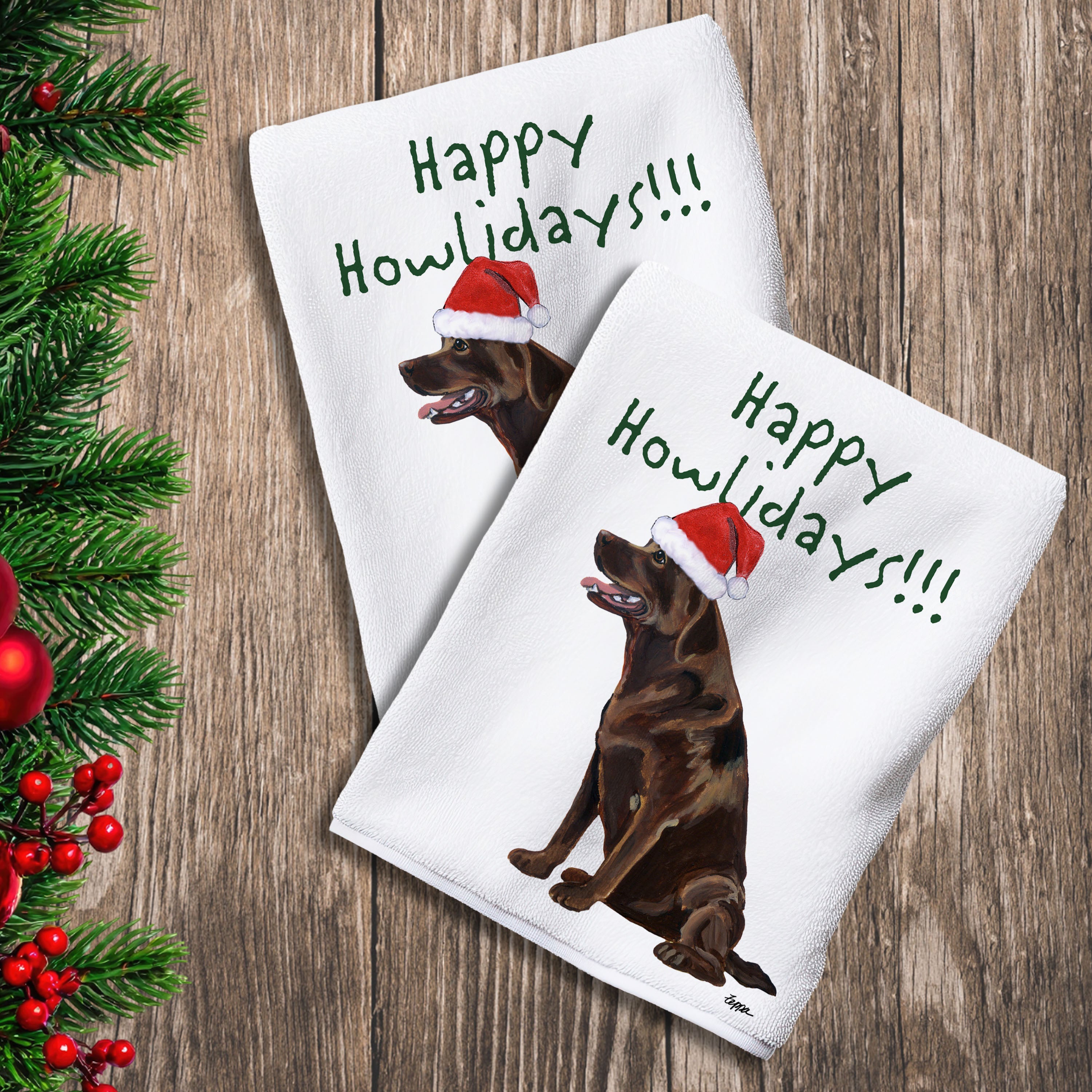 2 Kitchen Towels with a sitting chocolate Lab in a Santa Hat and Happy Howlidays text.