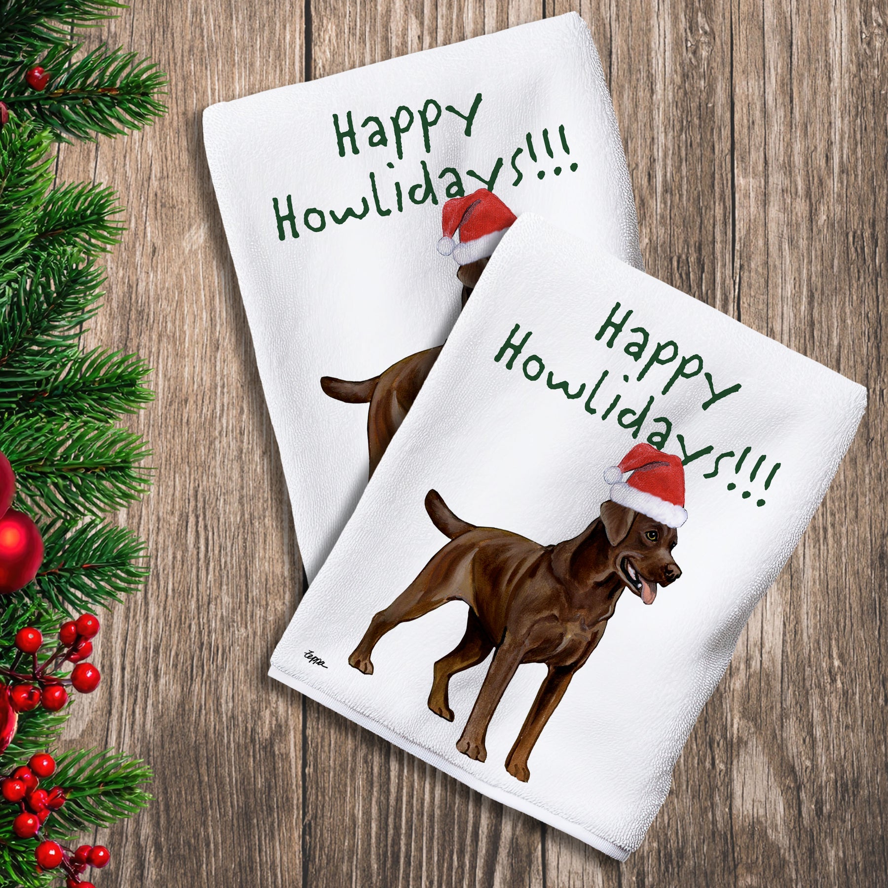 2 Kitchen Towels with a chocolate Lab in a Santa Hat and Happy Howlidays text.