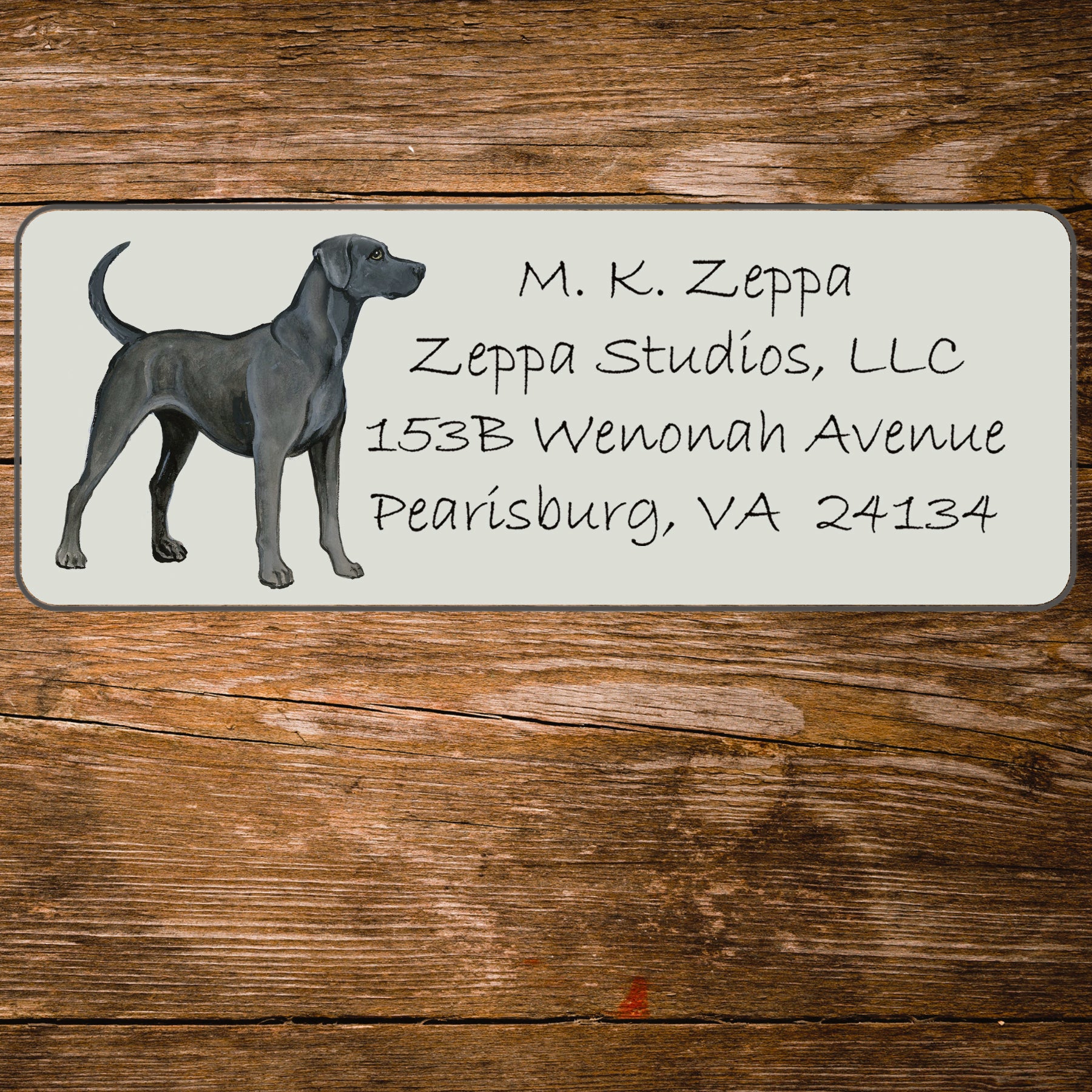Return address label with an illustration of a Lacy Dog.