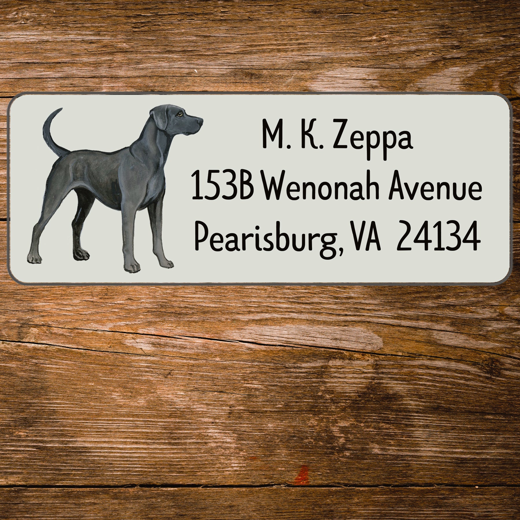 Return address label with an illustration of a Lacy Dog.