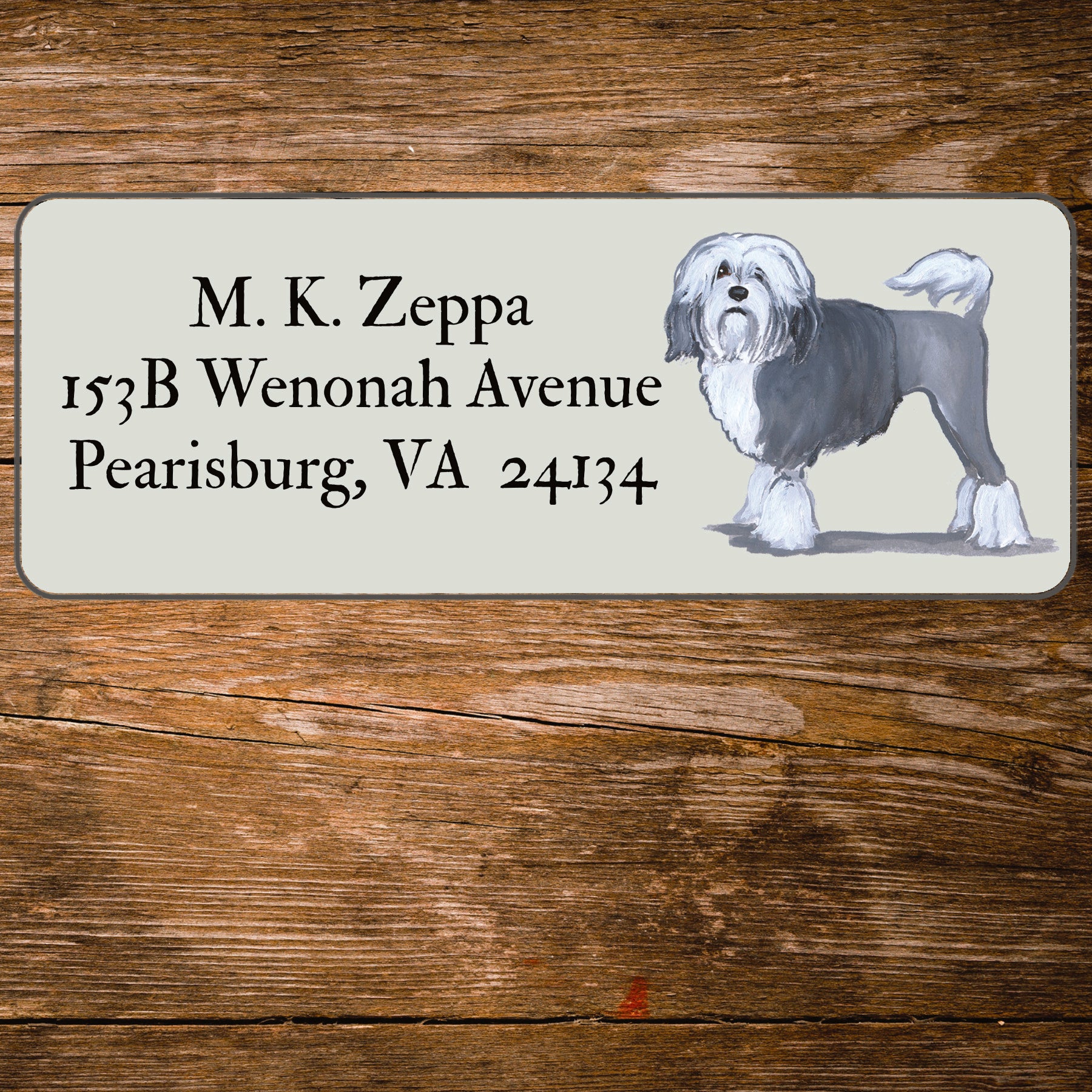 Return address label with a Lowchen illustration.