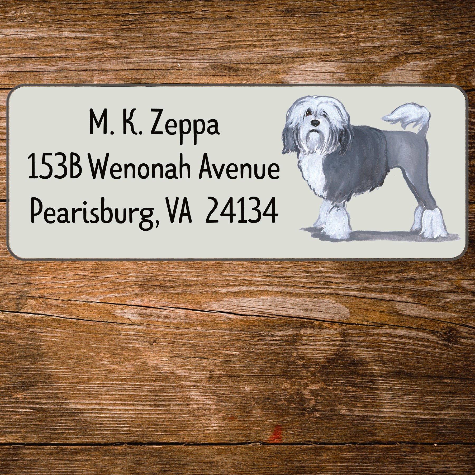 Return address label with a Lowchen illustration.