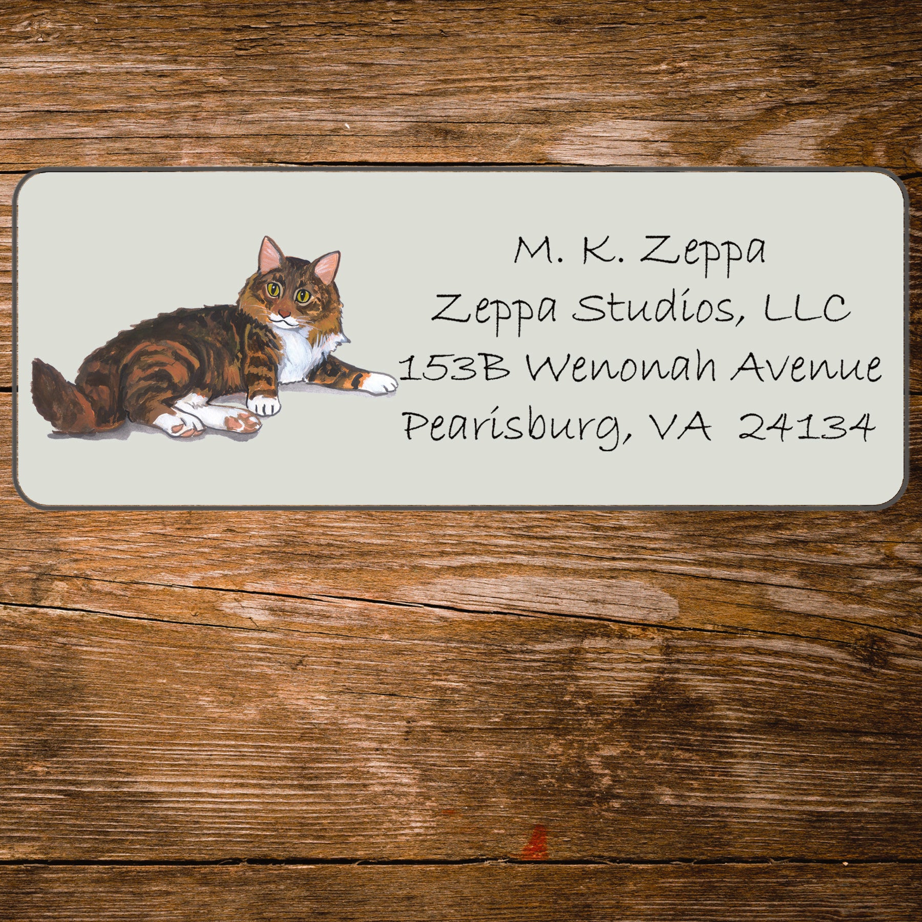 Return address label with a Maine Coon Cat illustration.