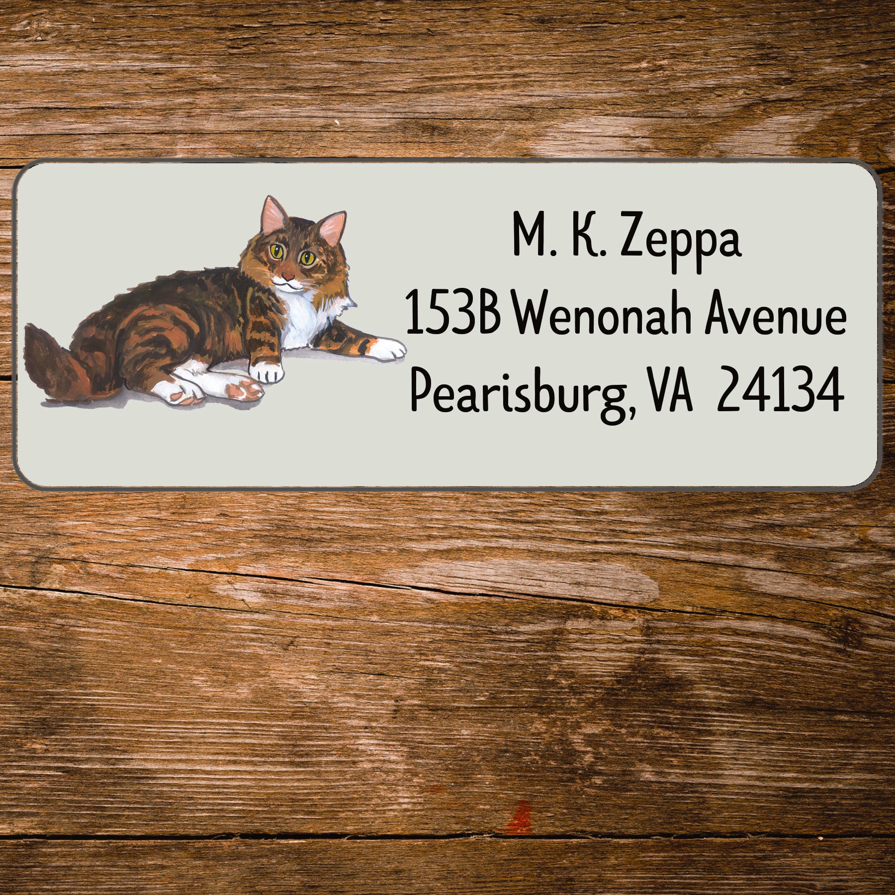Return address label with a Maine Coon Cat illustration.
