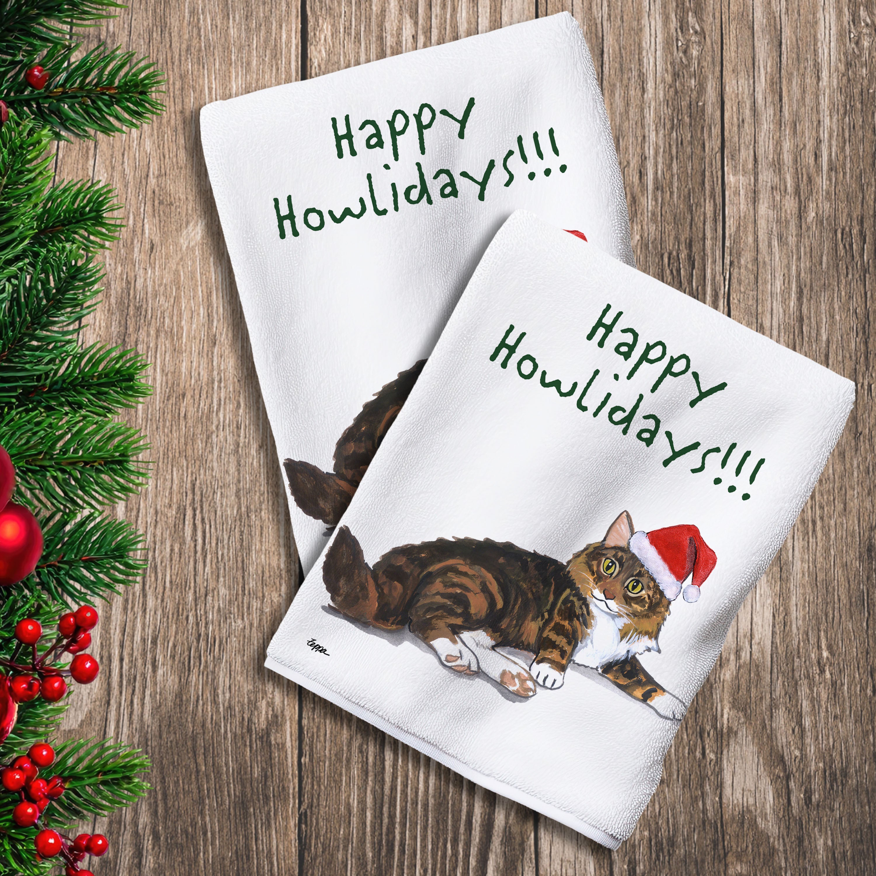 2 Kitchen Towels with a Maine Coon Cat in a Santa Hat and Happy Howlidays text.
