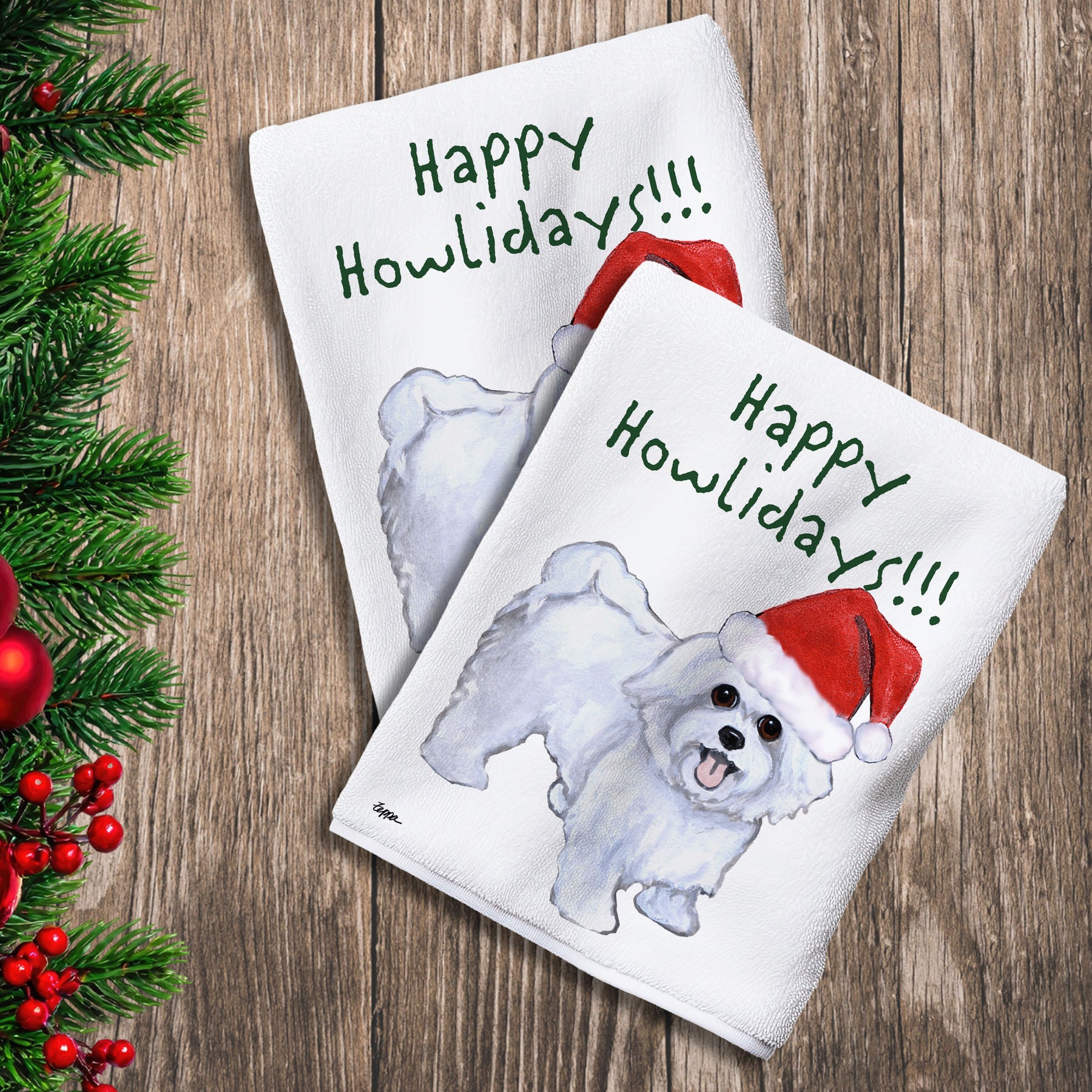 2 Kitchen Towels with a Maltese with a puppy clip in a Santa Hat and Happy Howlidays text.
