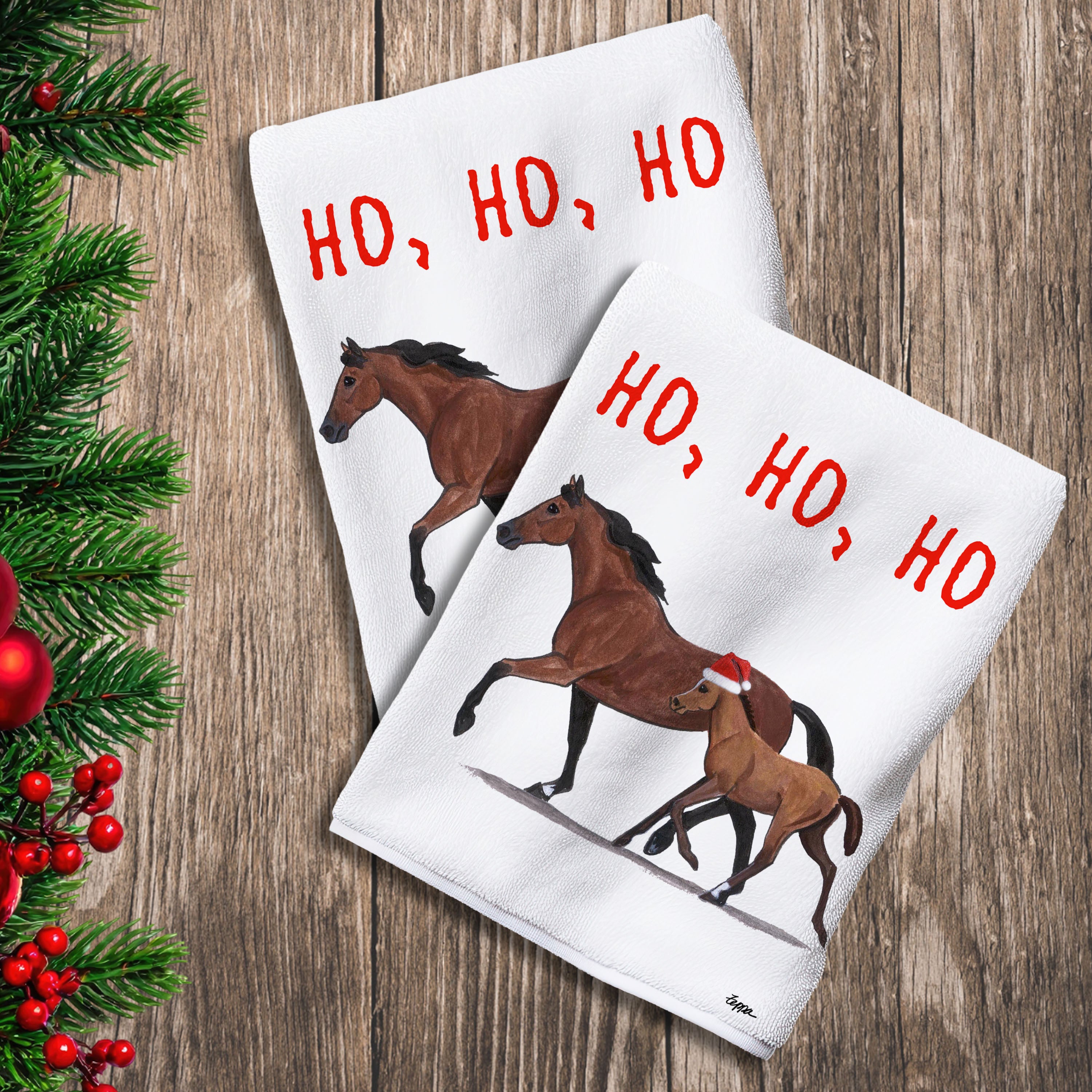 2 Kitchen Towels with a Mare and Foal in a Santa Hat and Ho Ho Ho text.