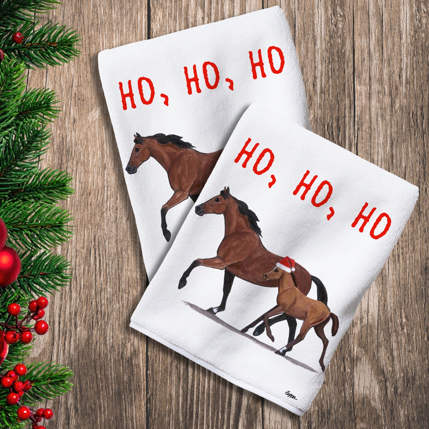 2 Kitchen Towels with a Mare and Foal in a Santa Hat and Ho Ho Ho text.