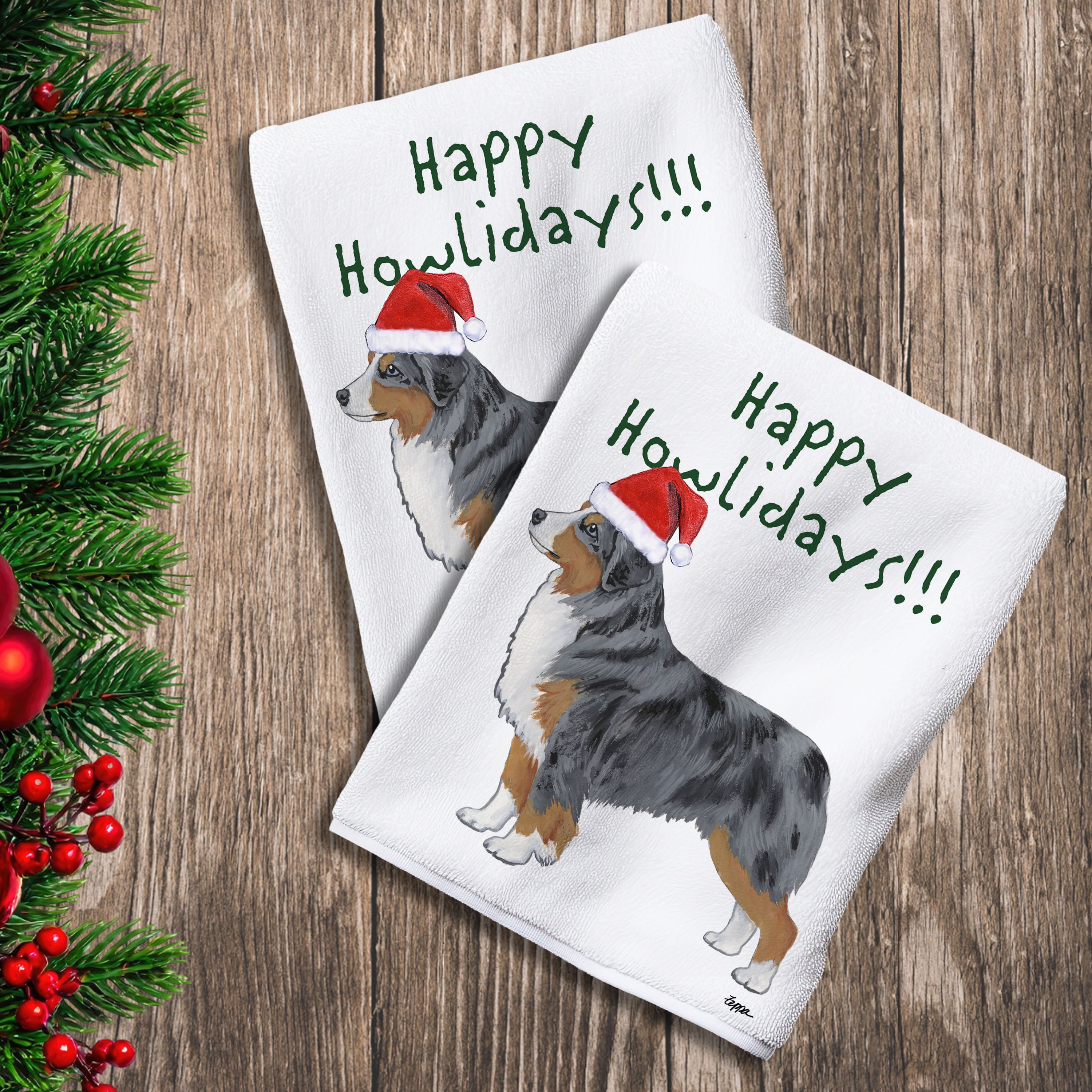 2 Kitchen Towels with a Miniature American Shepherd in a Santa Hat and Happy Howlidays text.