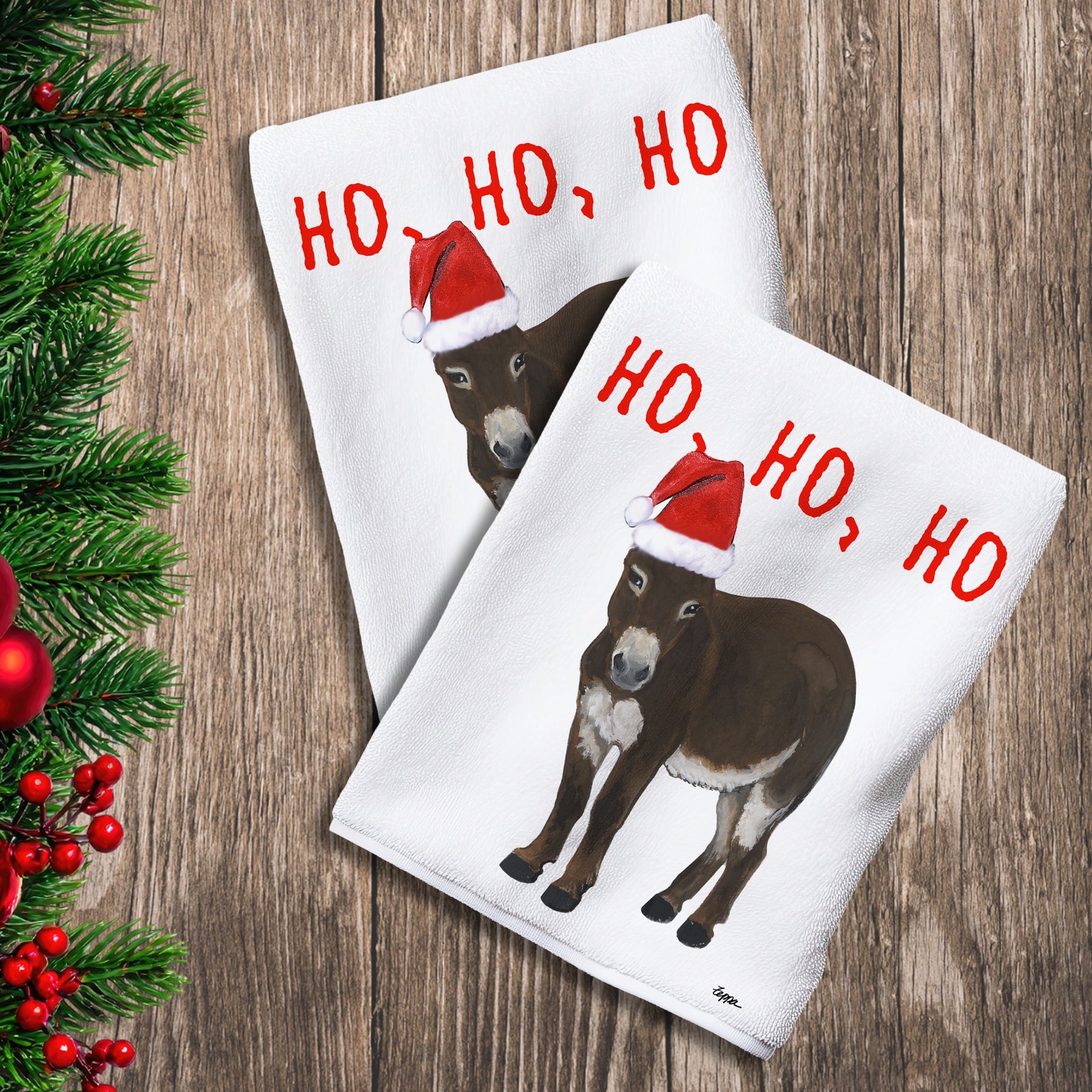 2 Kitchen Towels with a Miniature Donkey in a Santa Hat and Ho Ho Ho text.