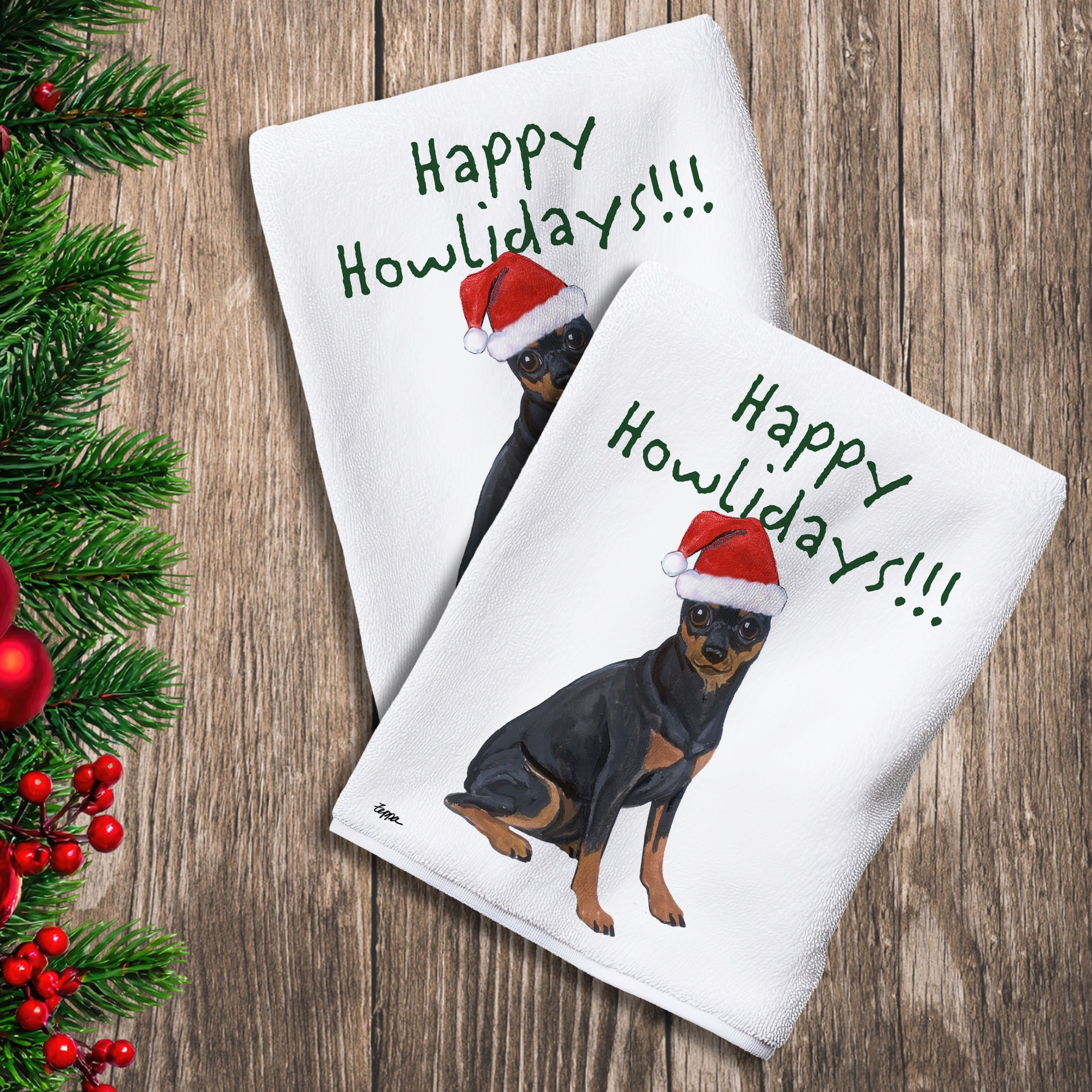 2 Kitchen Towels with a Miniature Pinscher in a Santa Hat and Happy Howlidays text.
