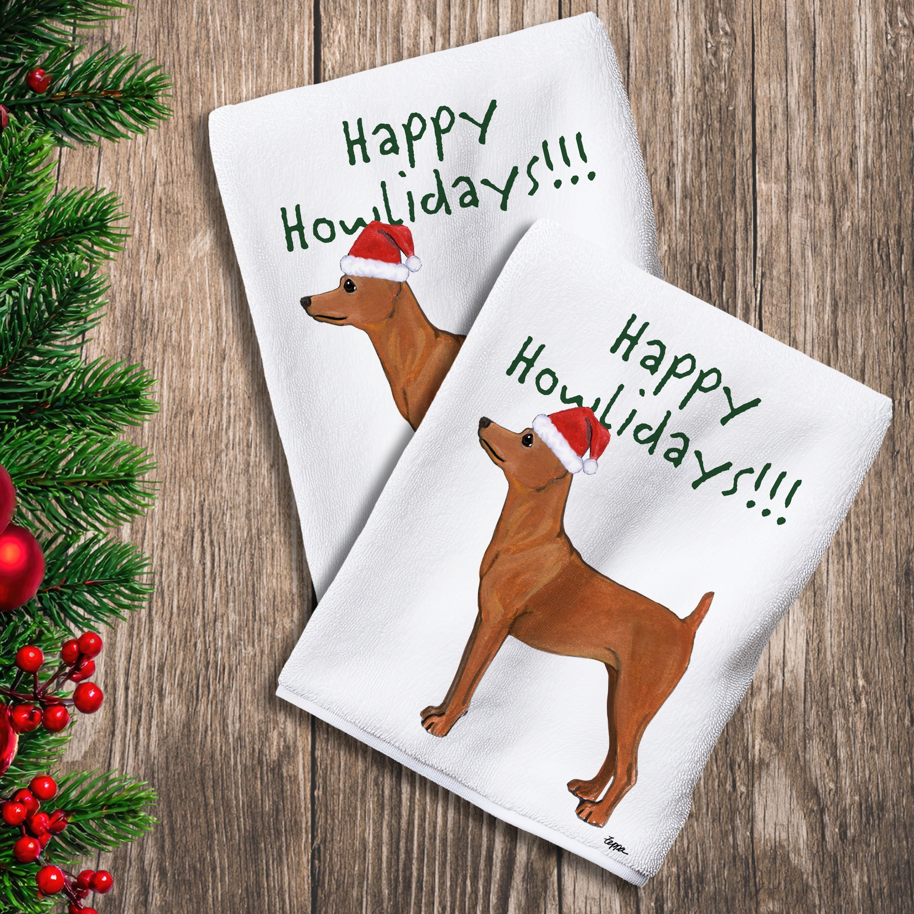 2 Kitchen Towels with a red Miniature Pinscher in a Santa Hat and Happy Howlidays text.
