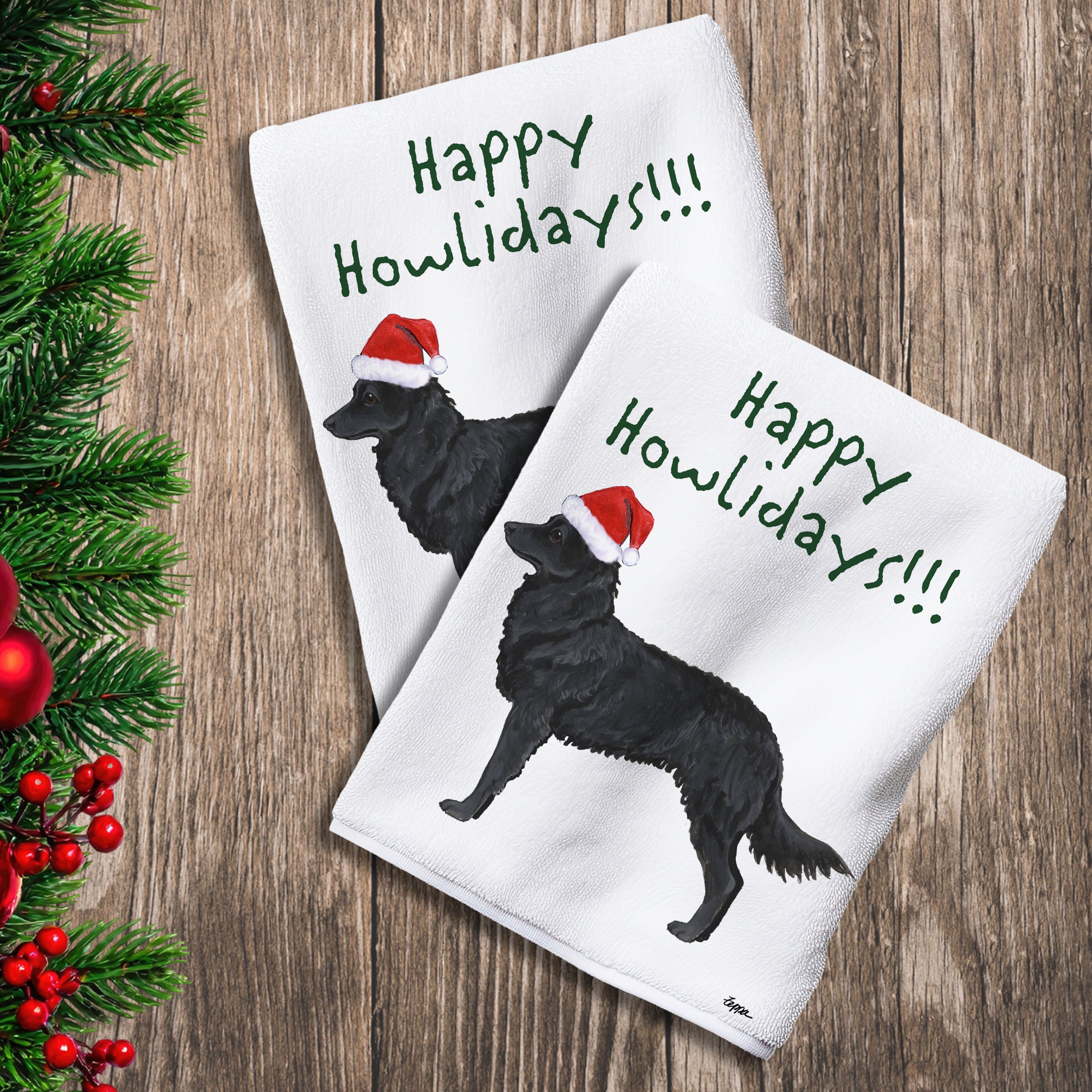 2 Kitchen Towels with a Mudi in a Santa Hat and Happy Howlidays text.