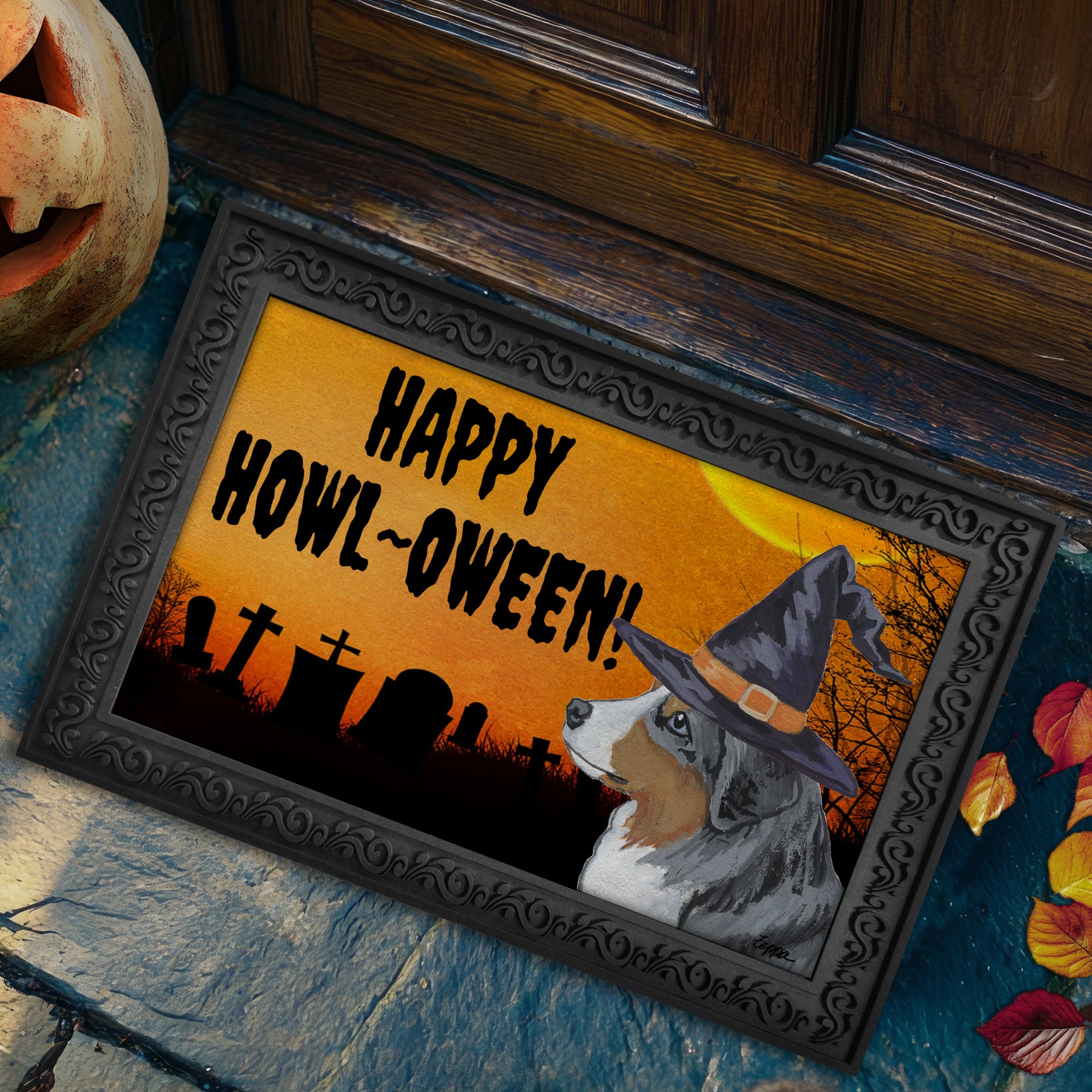 Miniature American Shepherd in a witch's hat on a Happy Howl-ween doormat.