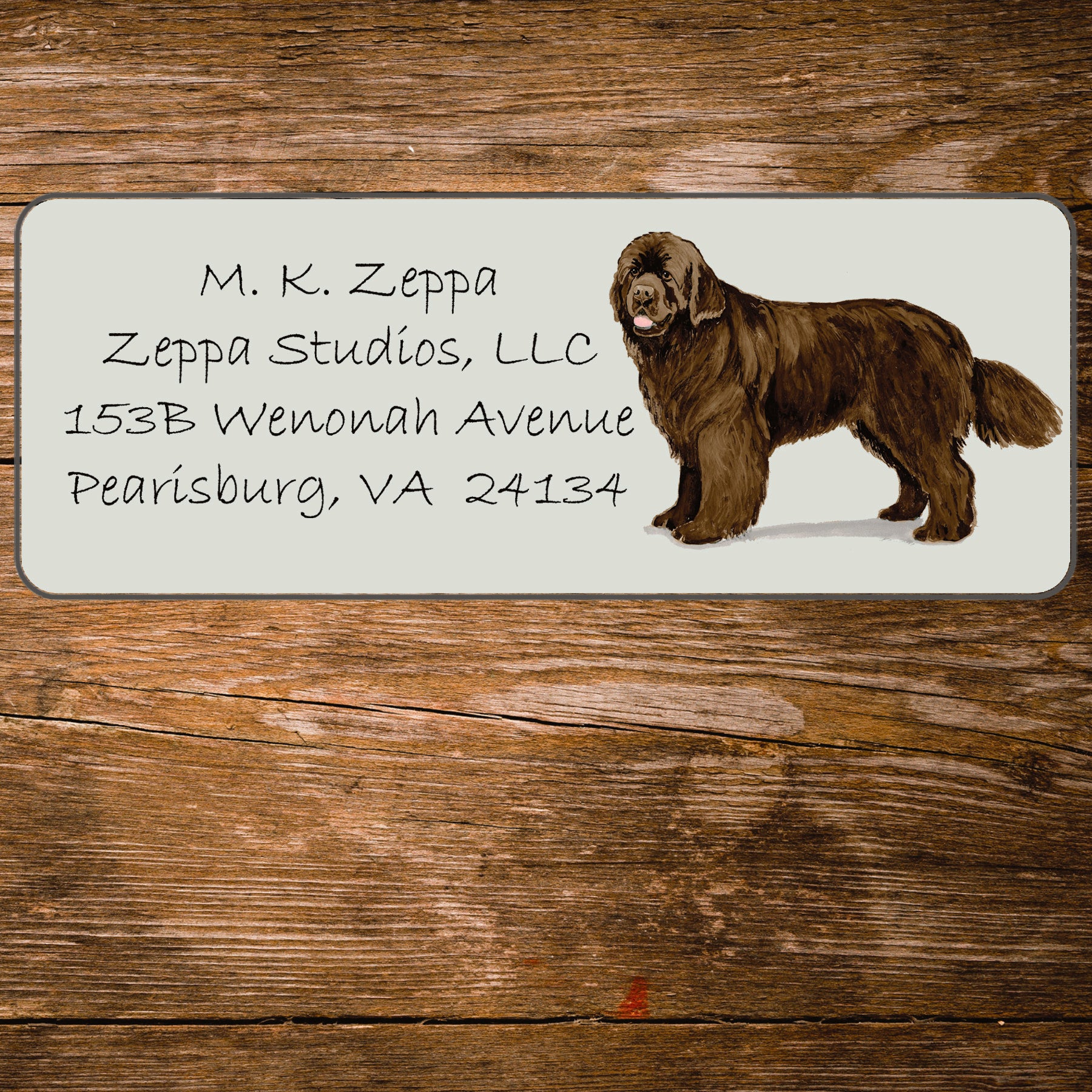 Return address label with a Newfoundland illustration.