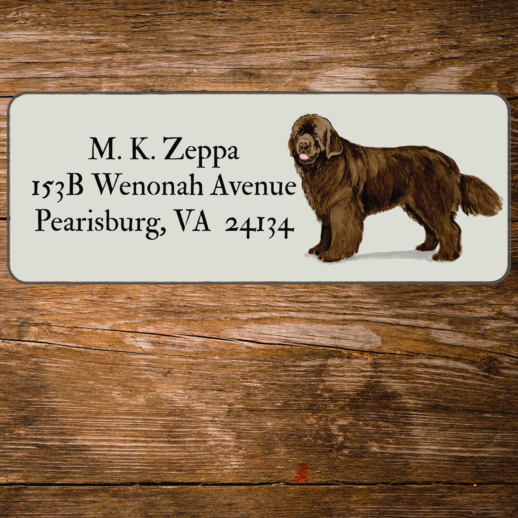 Return address label with a Newfoundland illustration.