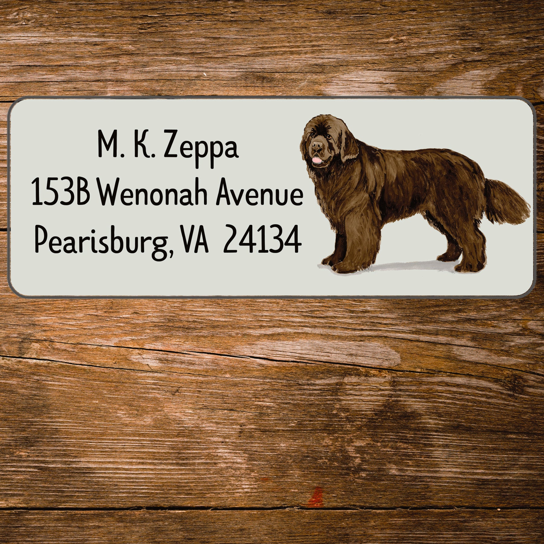 Return address label with a Newfoundland illustration.