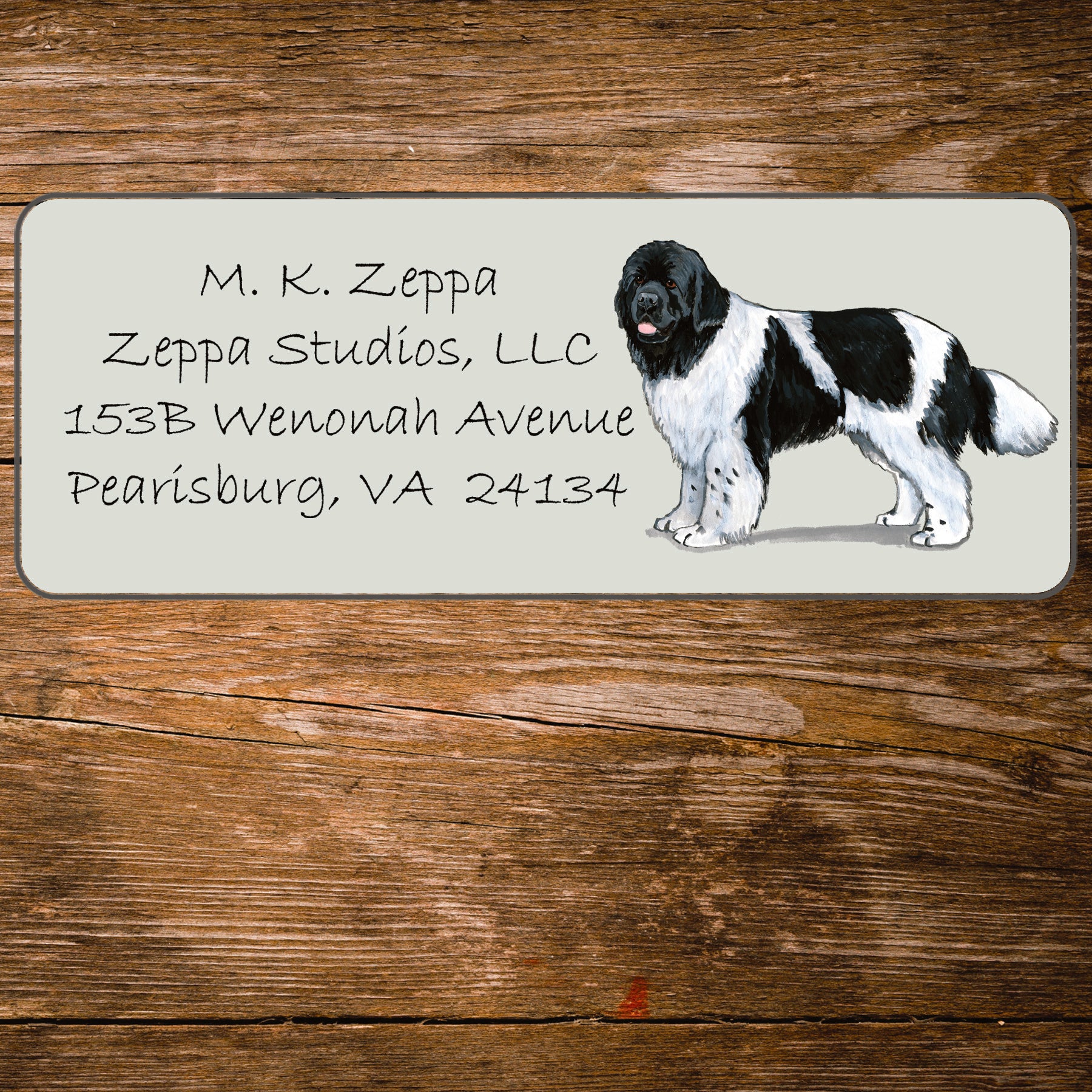 Return address label with a Newfoundland illustration.