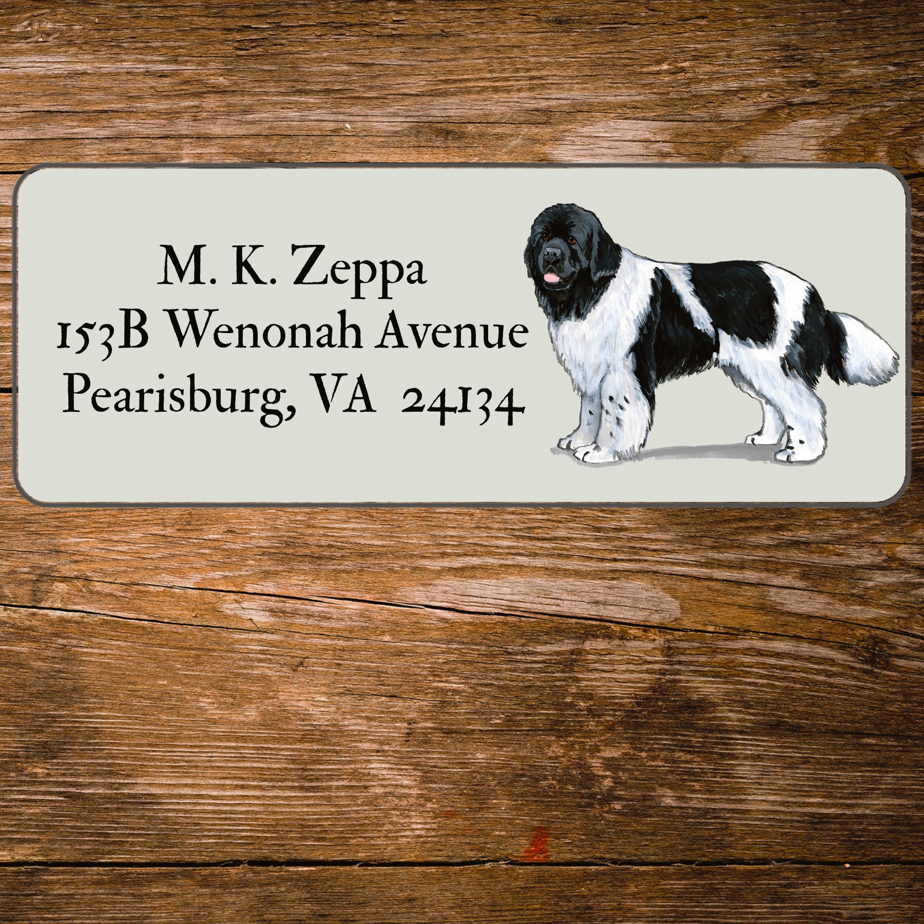 Return address label with a Newfoundland illustration.