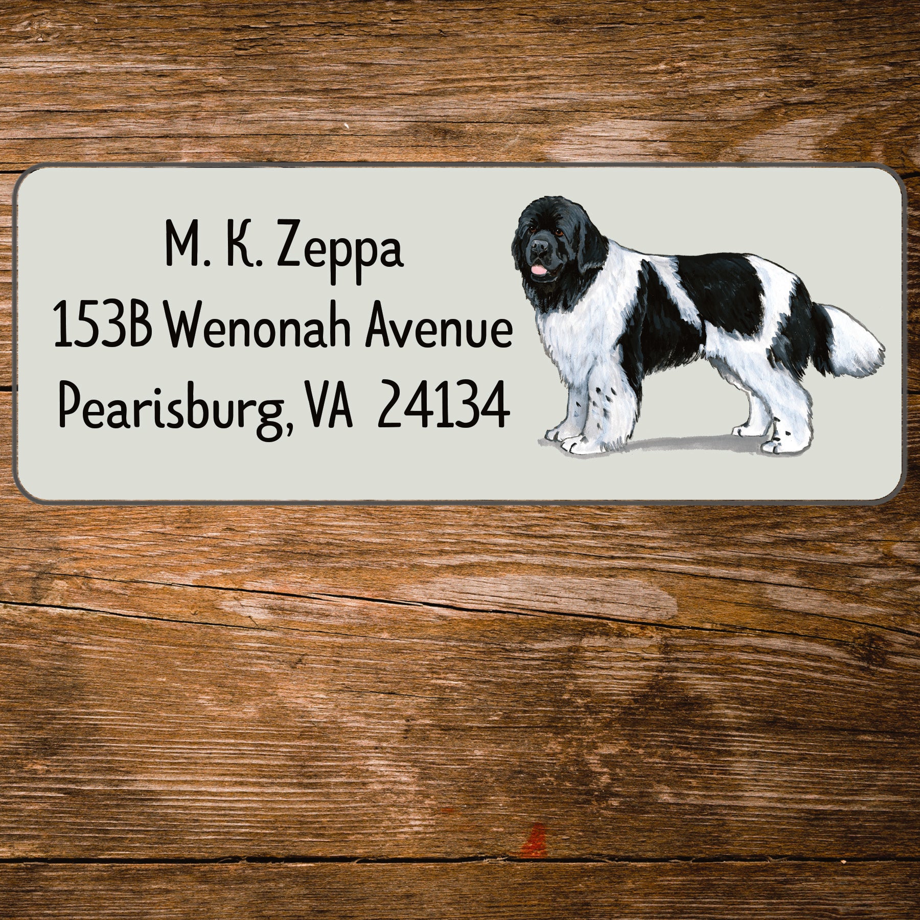 Return address label with a Newfoundland illustration.