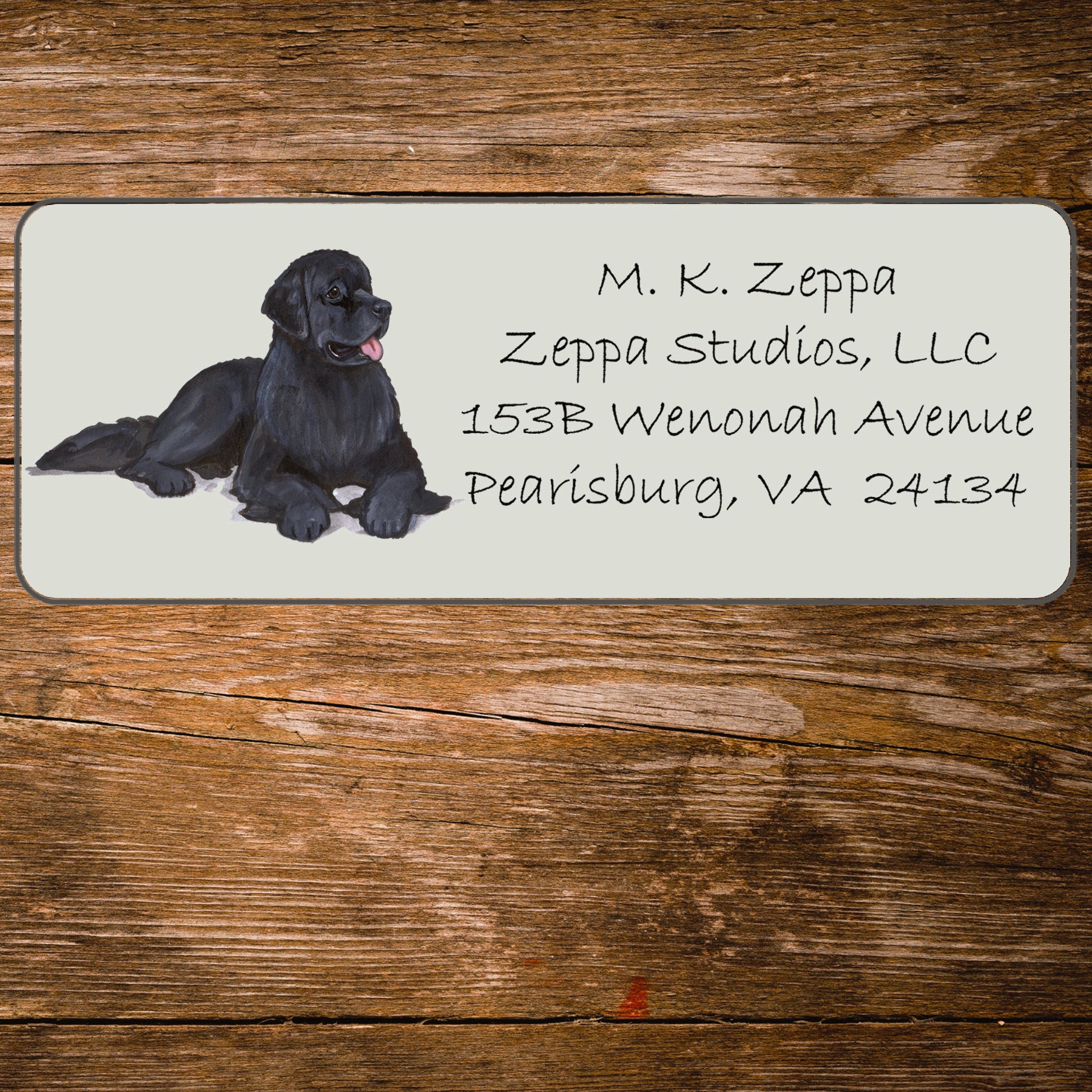 Return address label with a Newfoundland illustration.