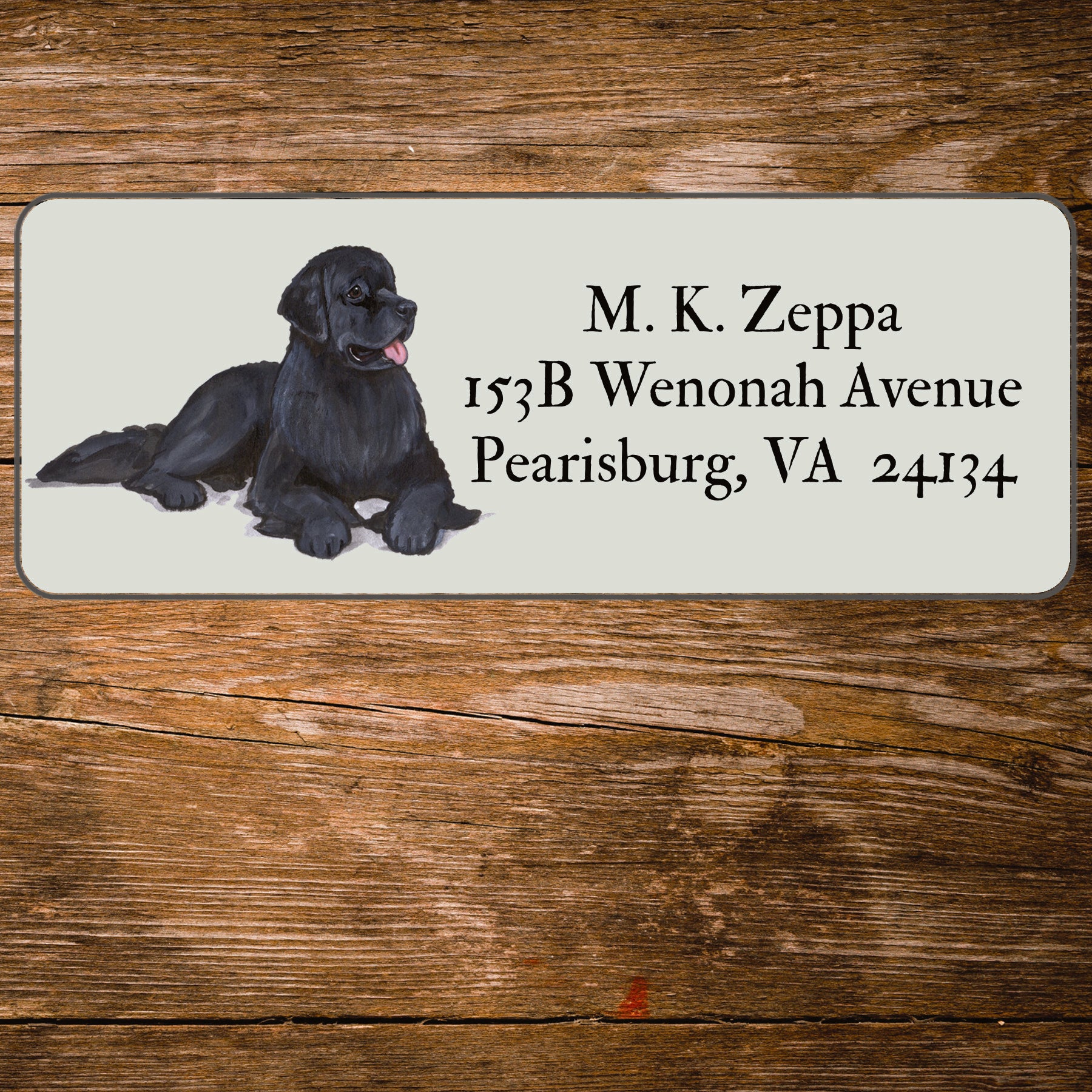 Return address label with a Newfoundland illustration.